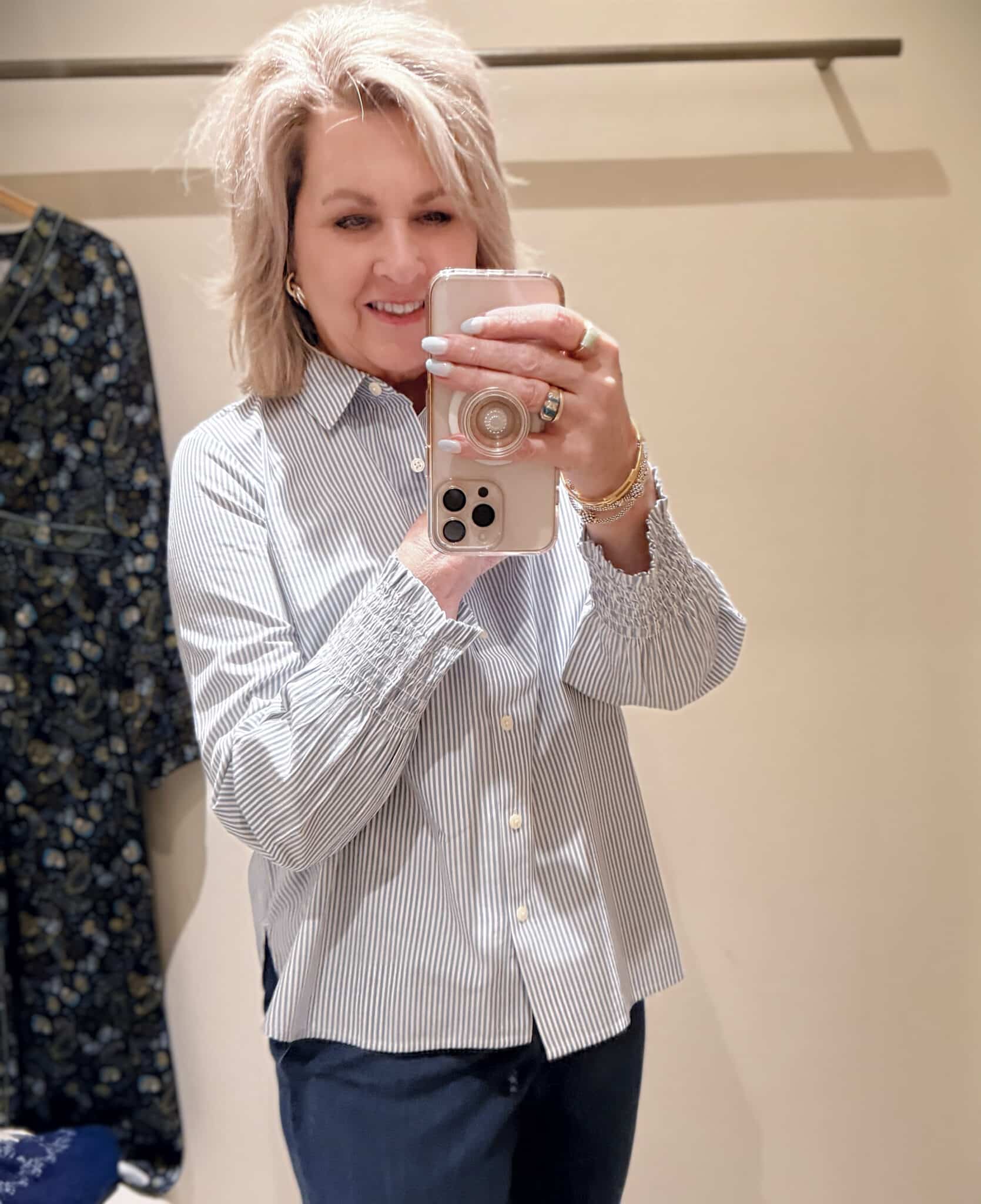 Tania doing a try-on haul at J.Jill  of a striped button up shirt