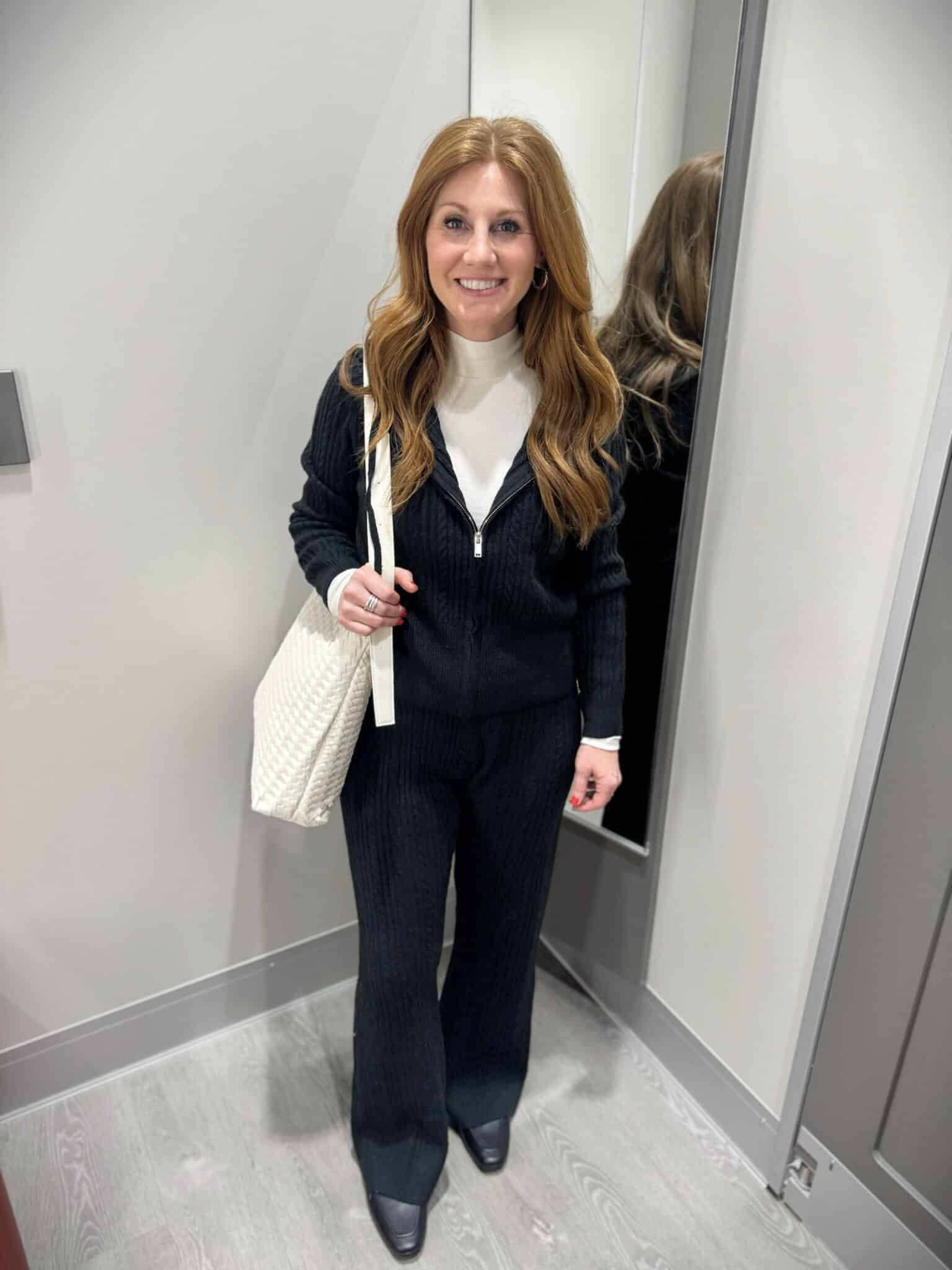 Stephanie wearing a black winter outfit from target
