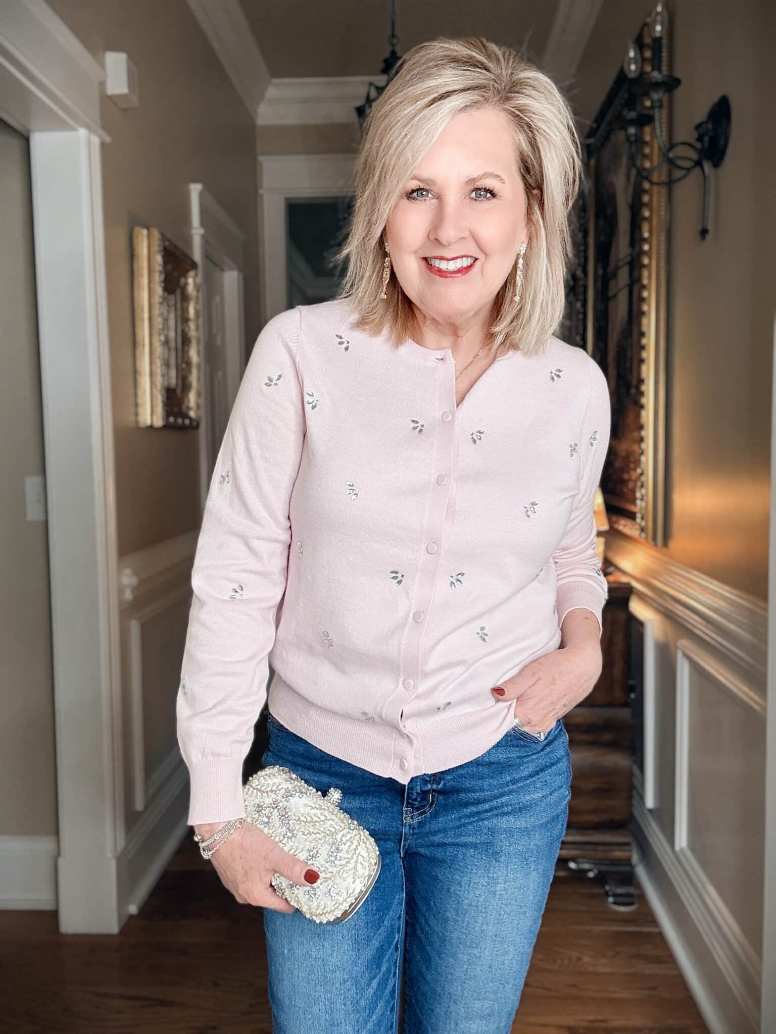 Tania wearing a pale pink embellished cardigan