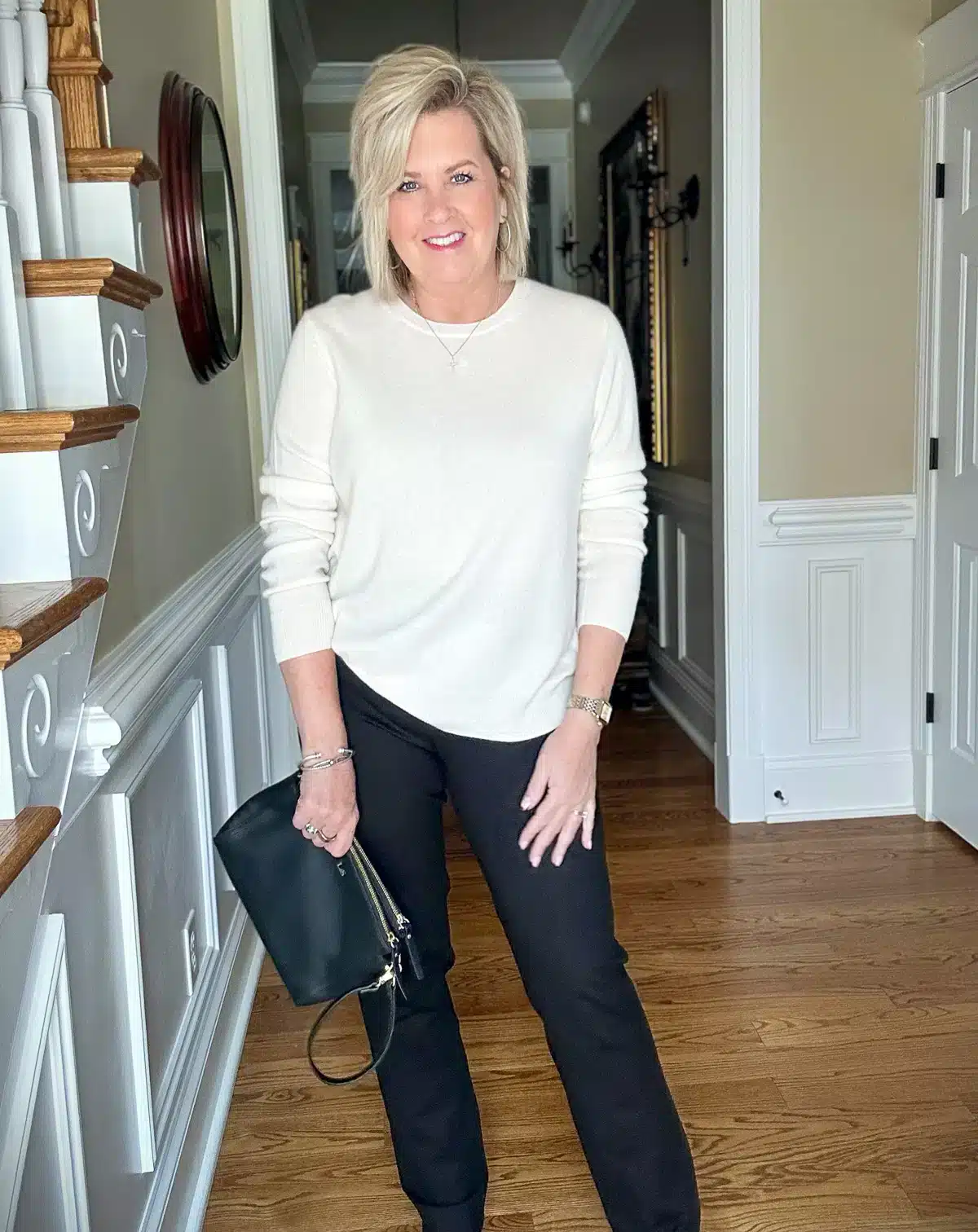 Tania holding a travel purse.