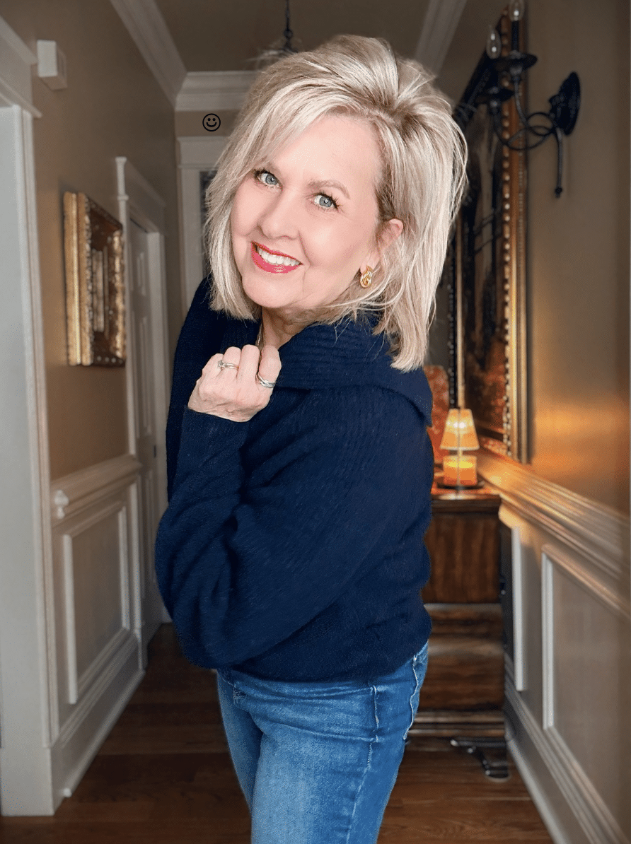 Tania wearing a navy chunky sweater with a large collar from Walmart