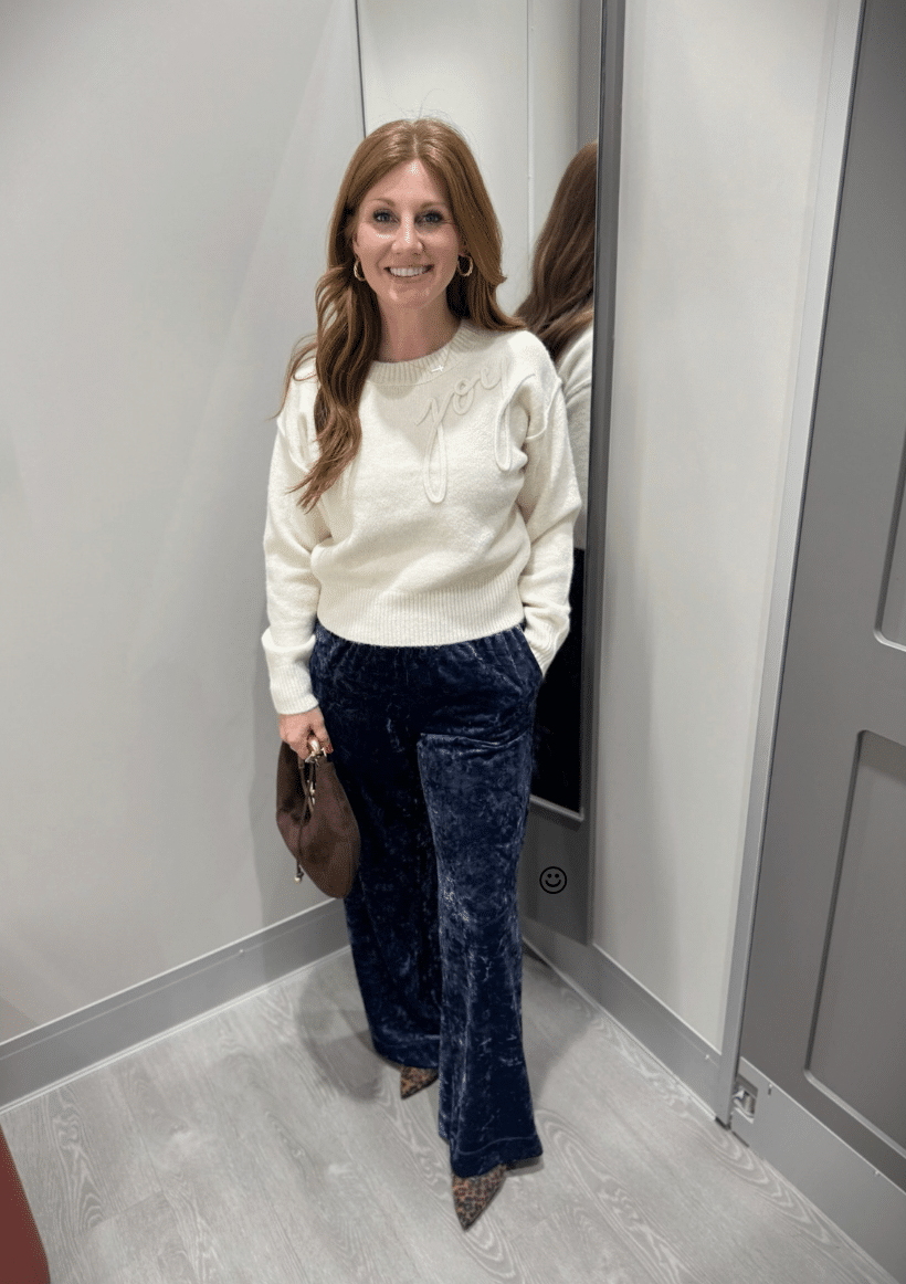 Stephanie wearing a Cream Crewneck Sweater Styled with Navy Velvet Pants from Target