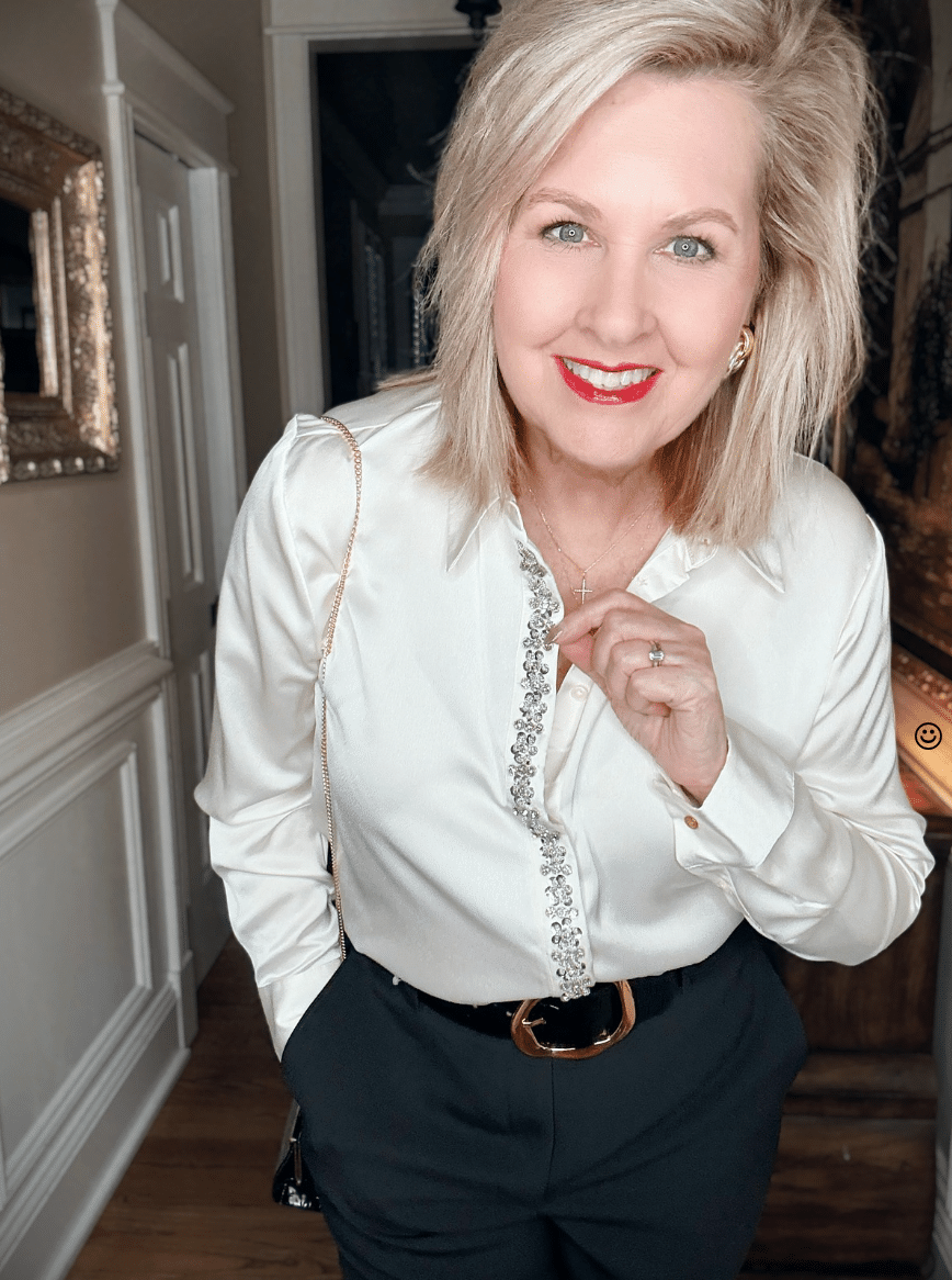 Tania wearing a satin embellished shirt