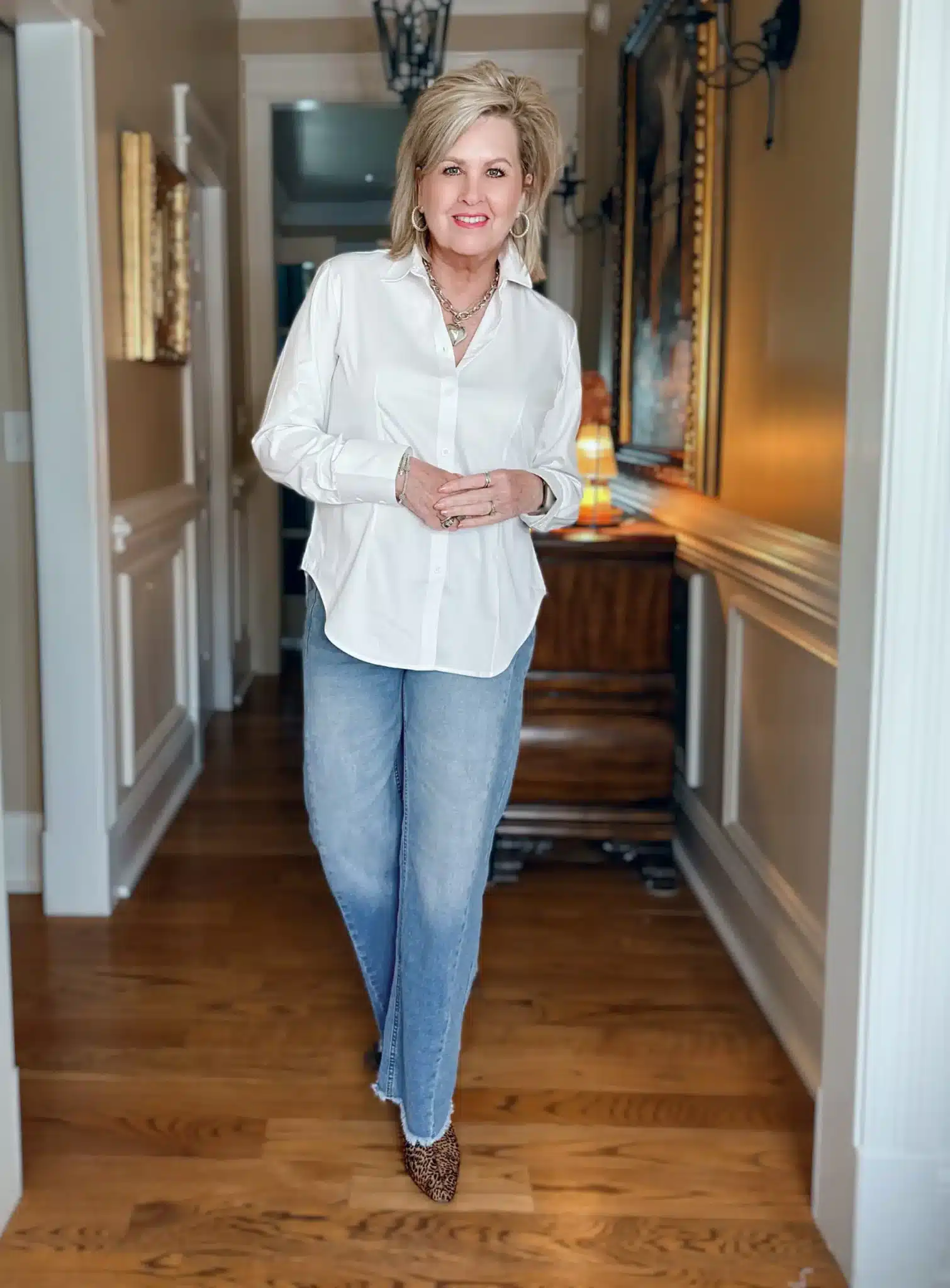 Tania wearing a white button down, elevated classics