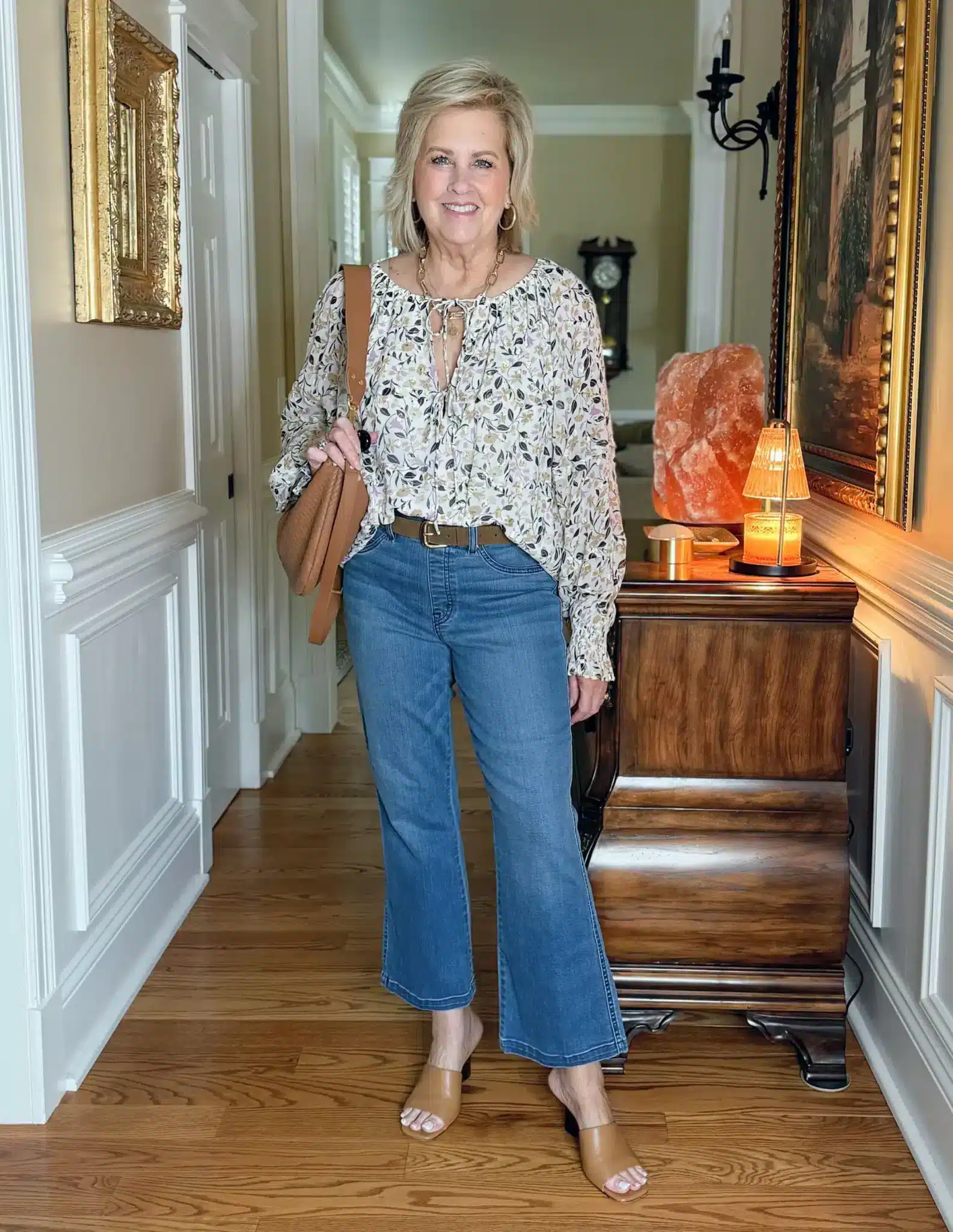 Tania wearing a peasant blouse with crop flare jeans