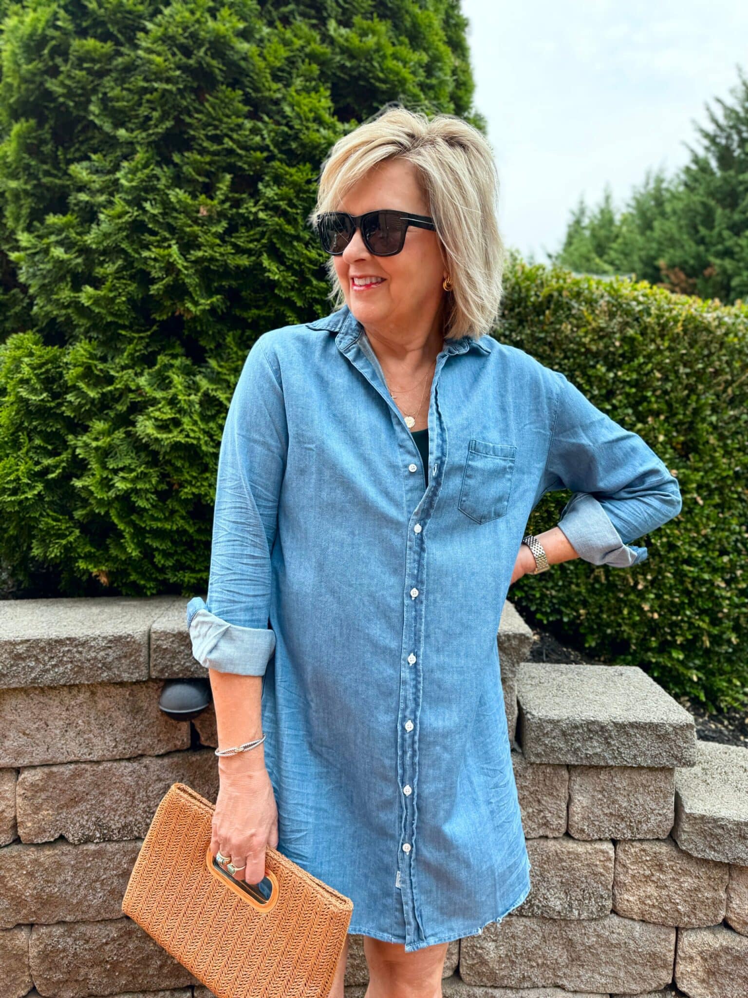 TANIA WEARING A MINI DENIM SHIRT DRESS