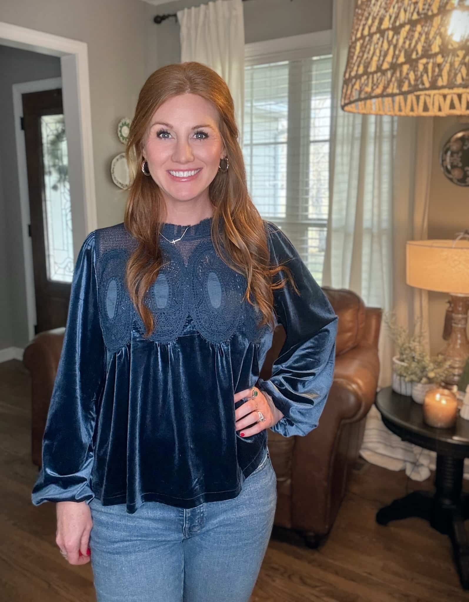 Petite red head wearing a beautiful blue velvet top with embellishments from Amazon