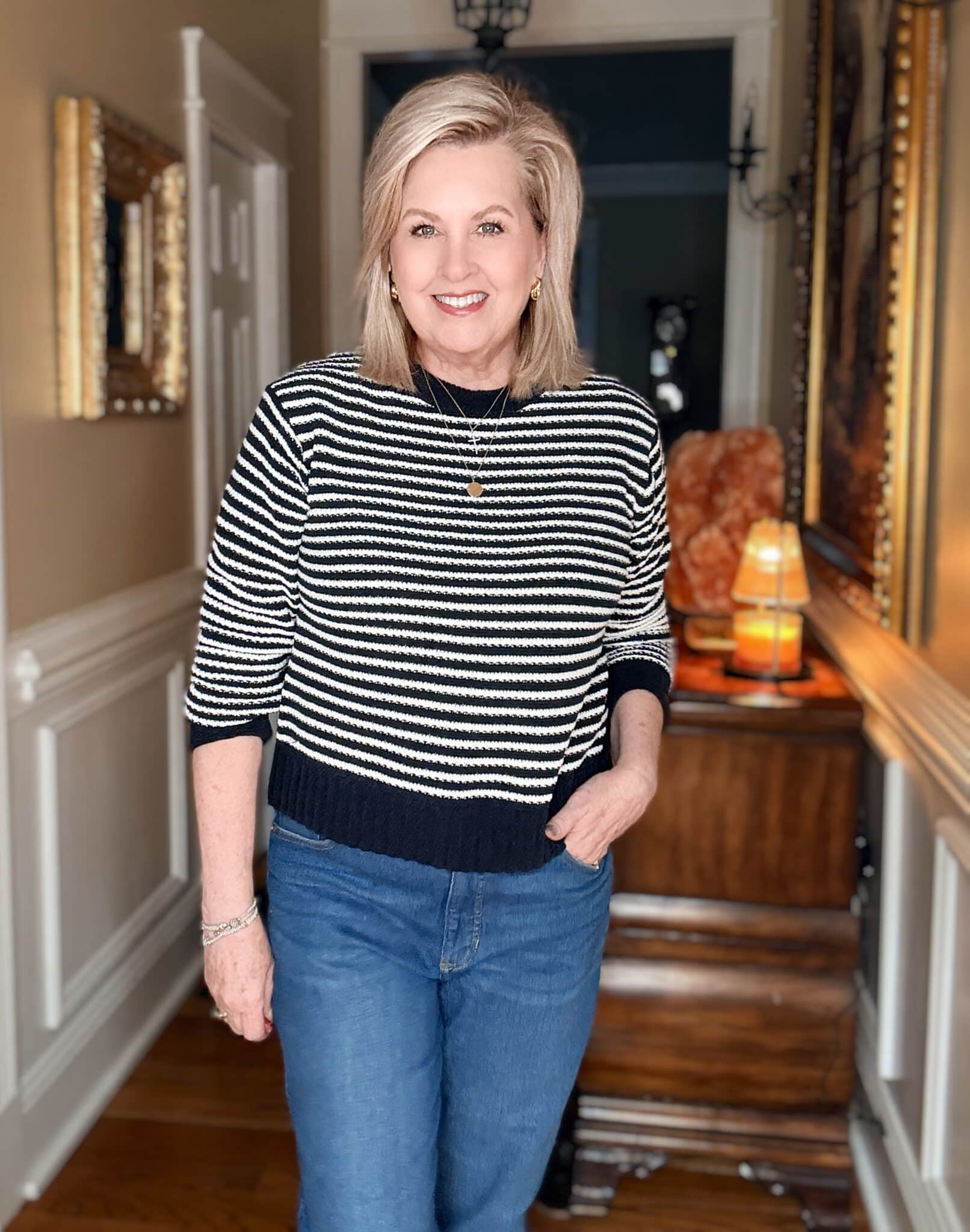 Tania wearing a navy & white striped sweater from Walmart