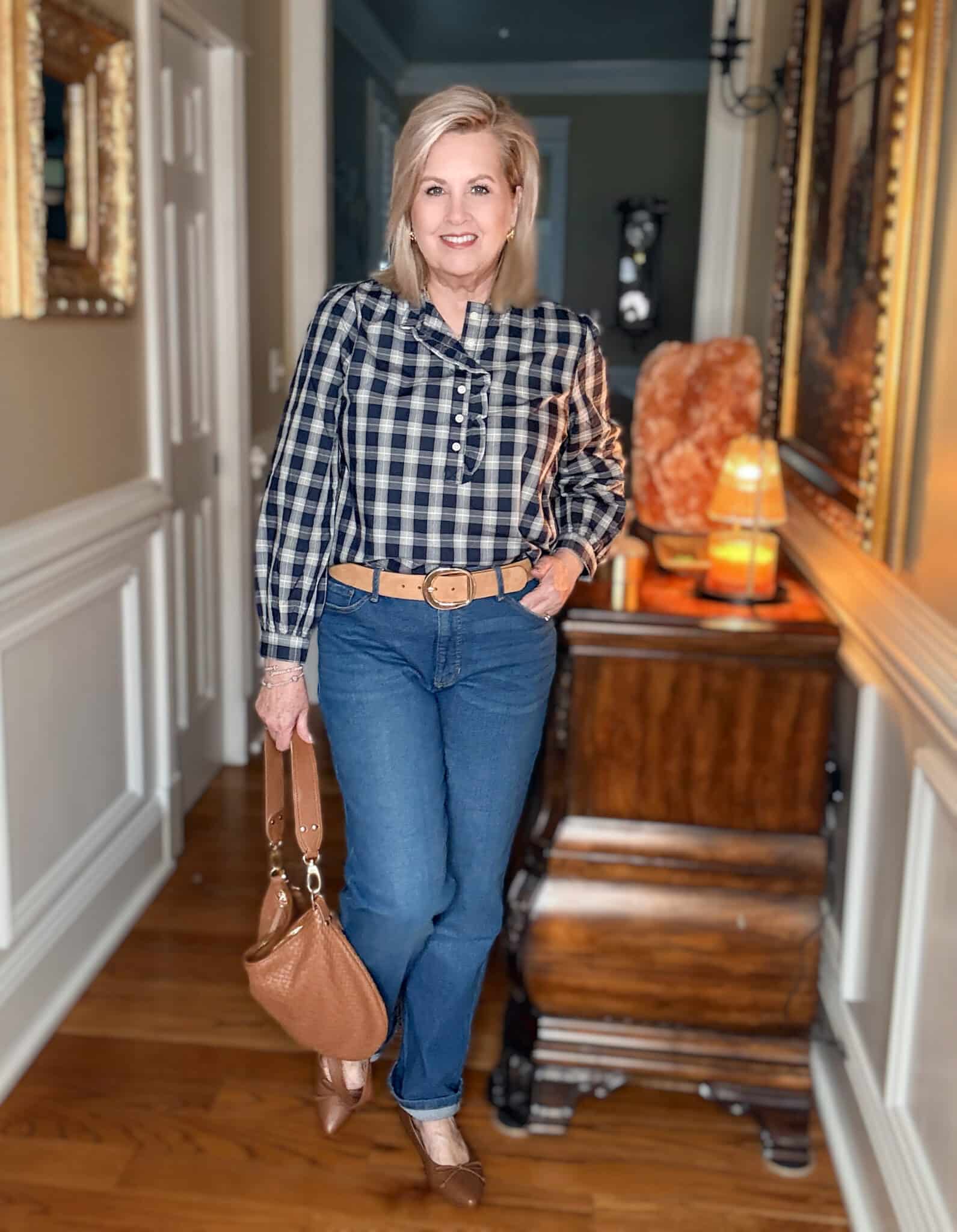 Tania wearing a ruffled check top with jeans from Walmart