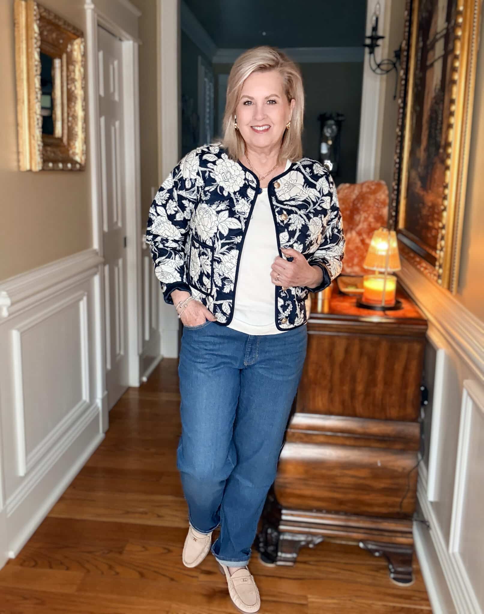 Tania wearing a blue & white quilted floral jacket and a white top with jeans from Walmart