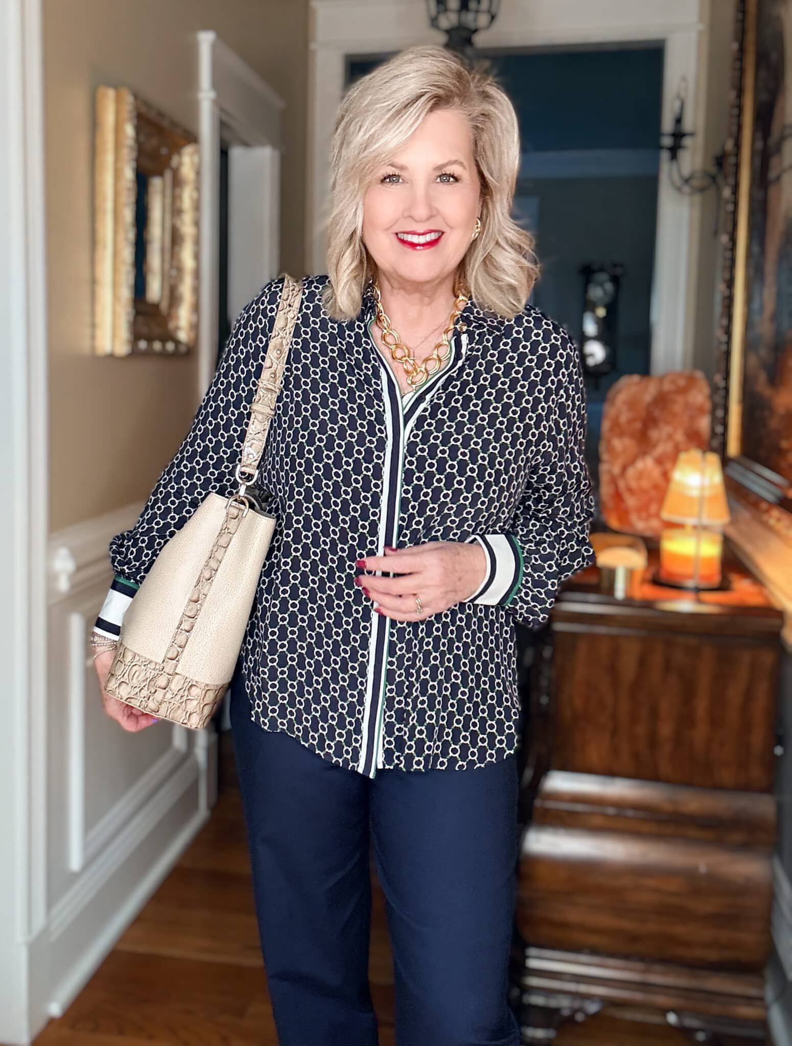 Tania wearing a blue and green blouse from Chico's