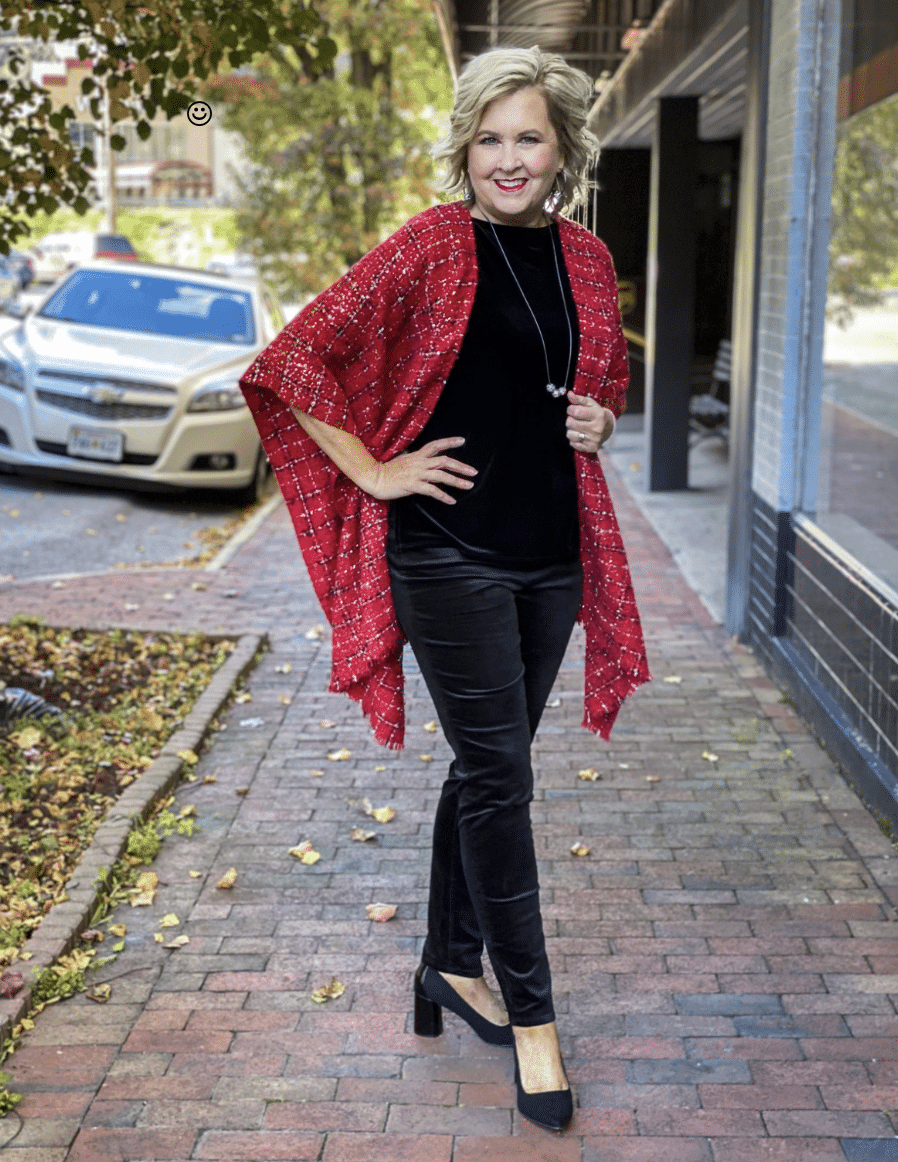 Fashion Blogger 50 Is Not Old looks taller and slimmer wearing a red ruana with a black velvet top and jeans from Chico's