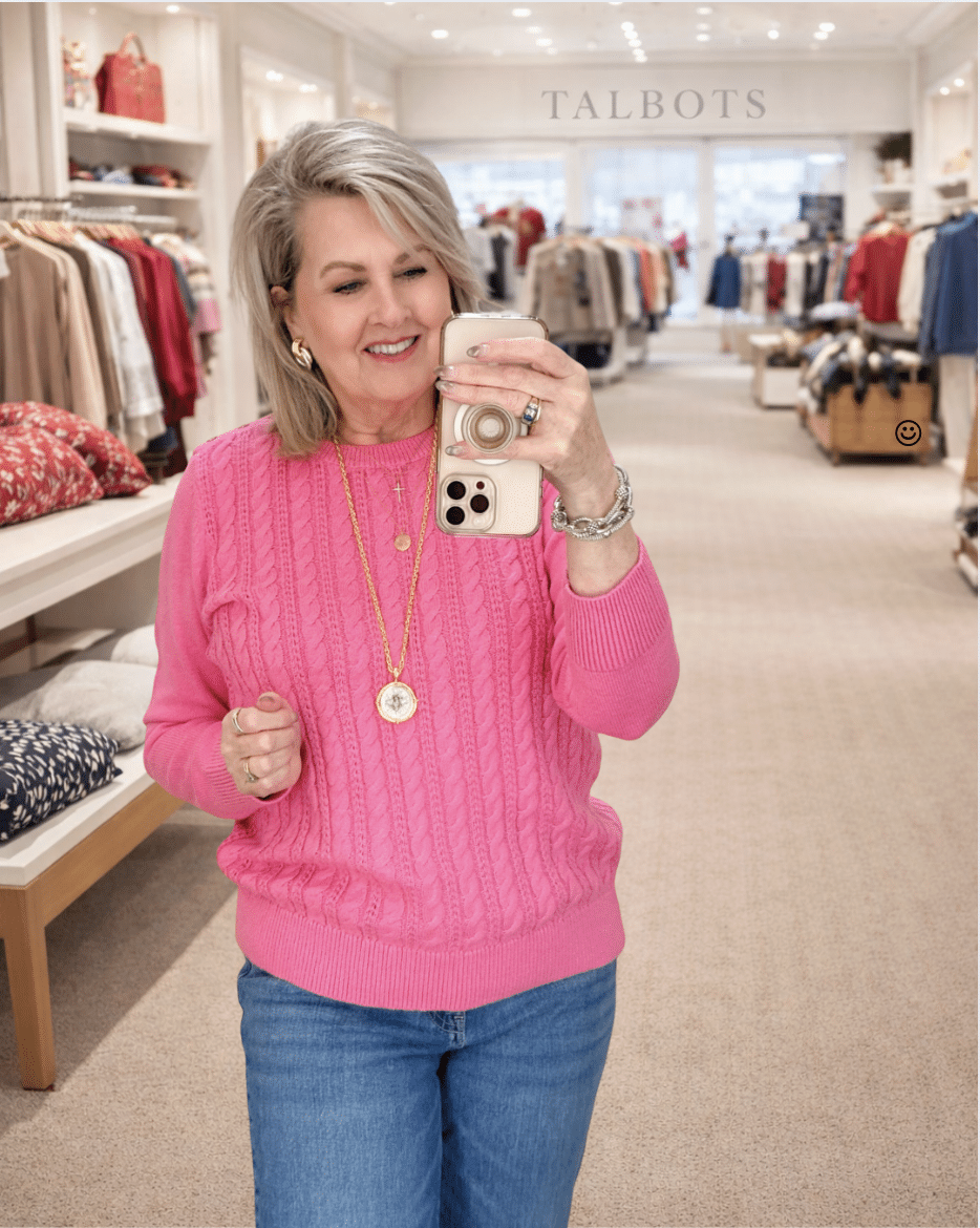 Tania wearing a pink cable knit sweater from Talbots