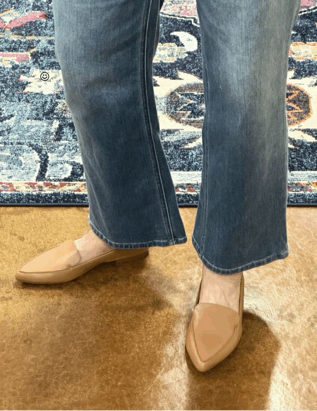 Tania wearing camel flats to make her look taller