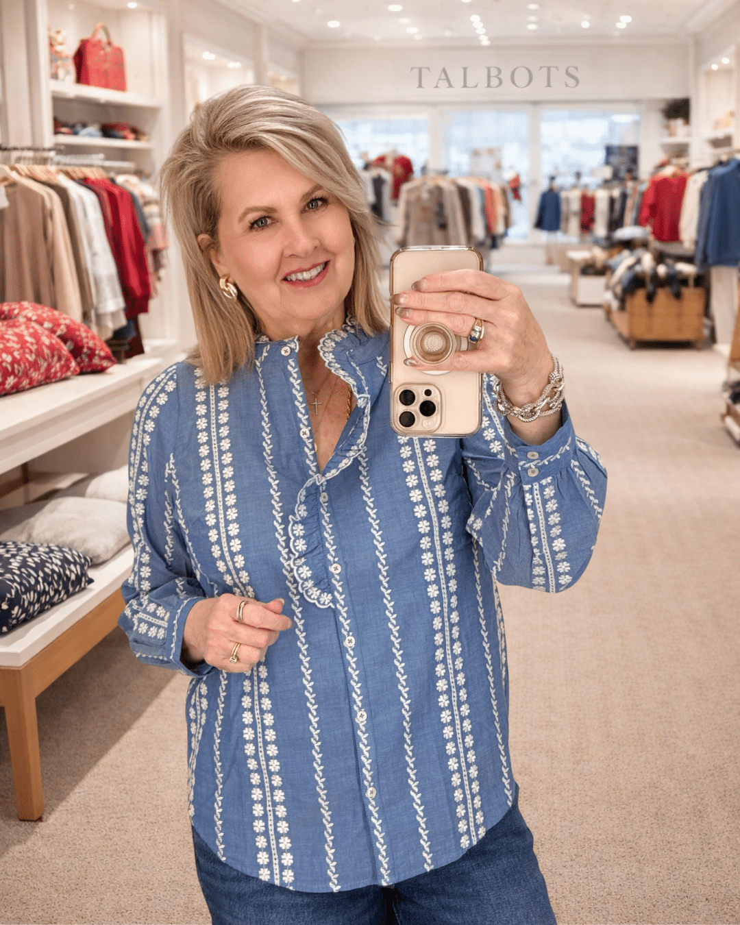 Tania wearing a ruffled neck top from Talbots