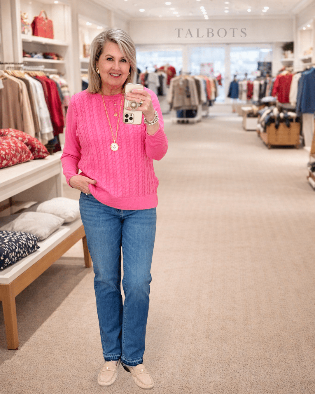 Tania wearing a pink cable knit sweater and jeans from Talbots
