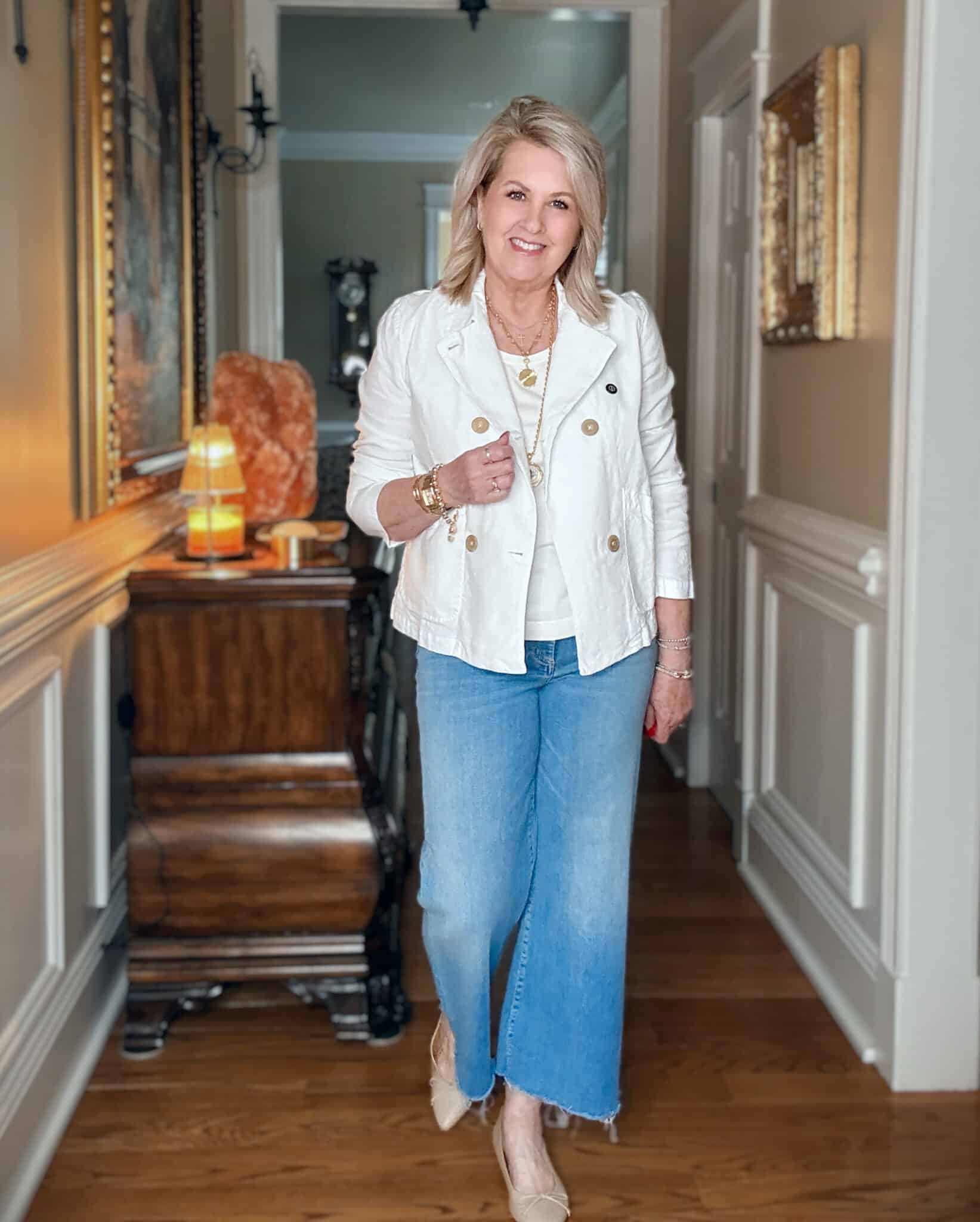 Tania wearing a linen white double breasted cropped peacoat and frayed jeans from Frank & Eileen