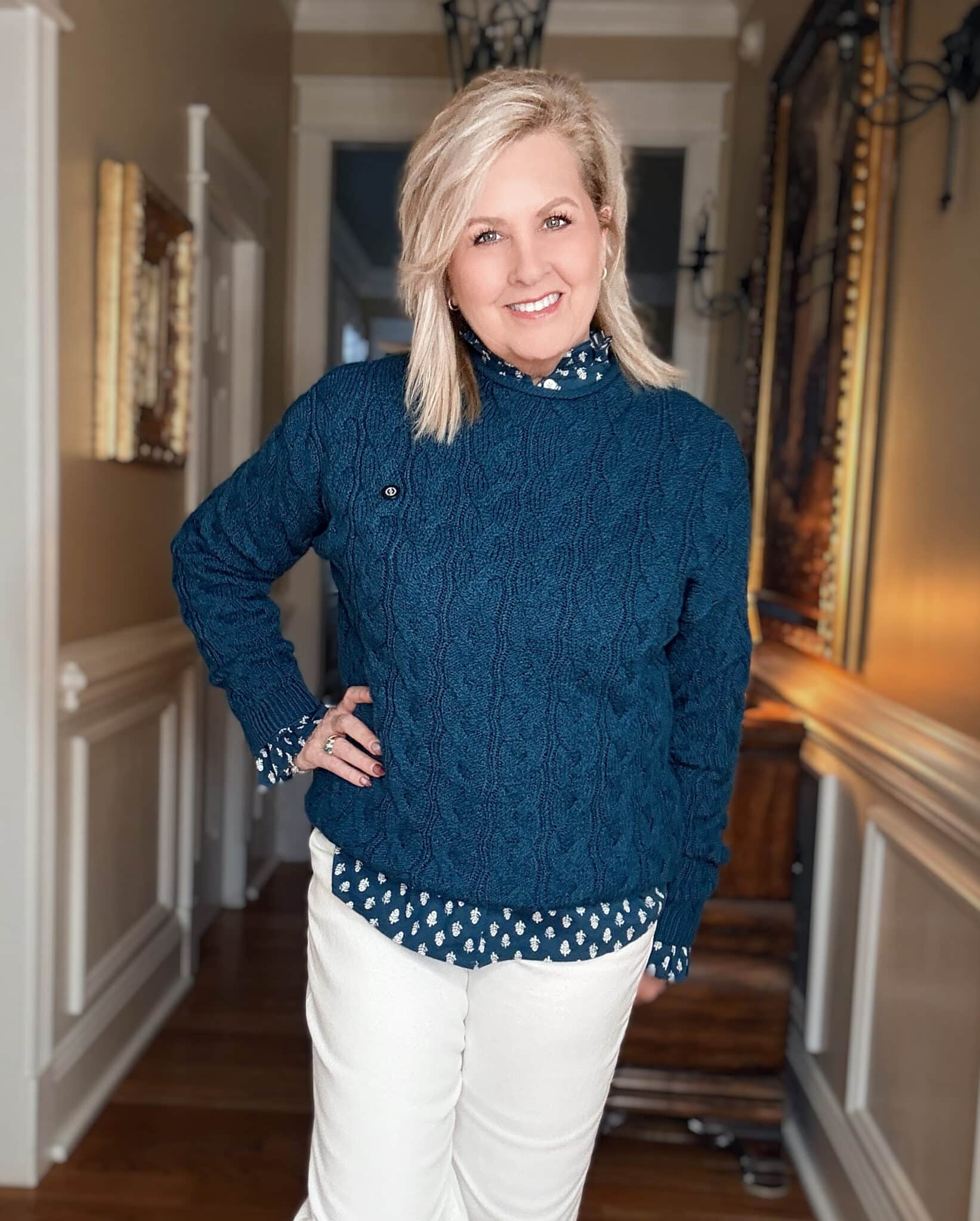 Tania wearing a teal and white shirt from J.Crew Factory with a teal sweater