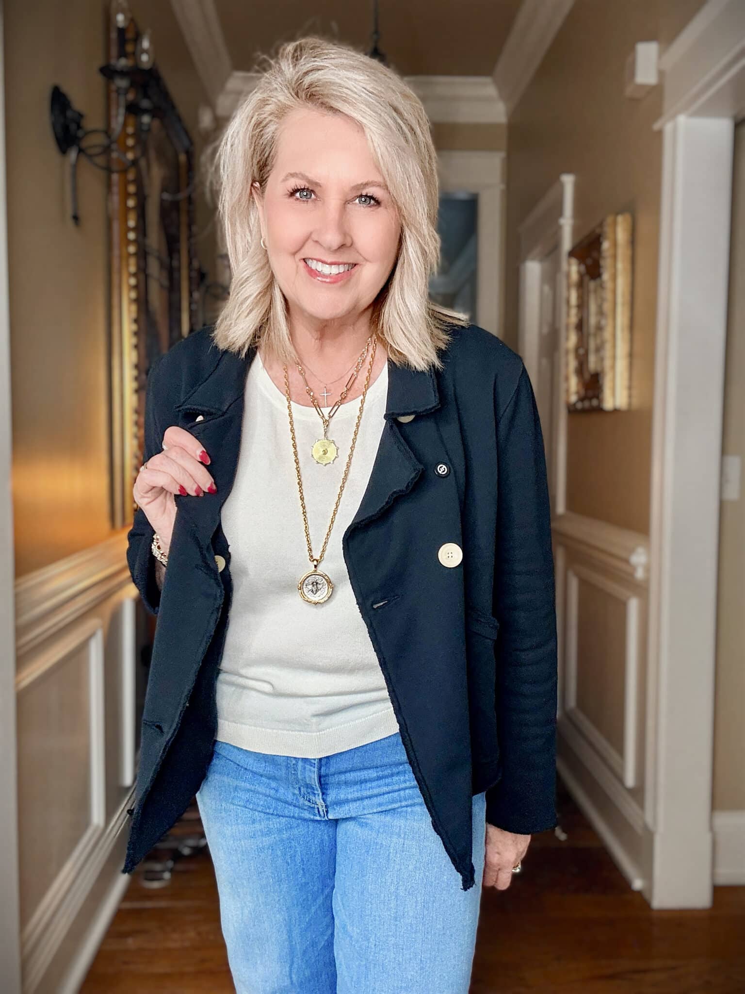 Tania leaning on a chest with a navy cropped peacoat from Frank & Eileen