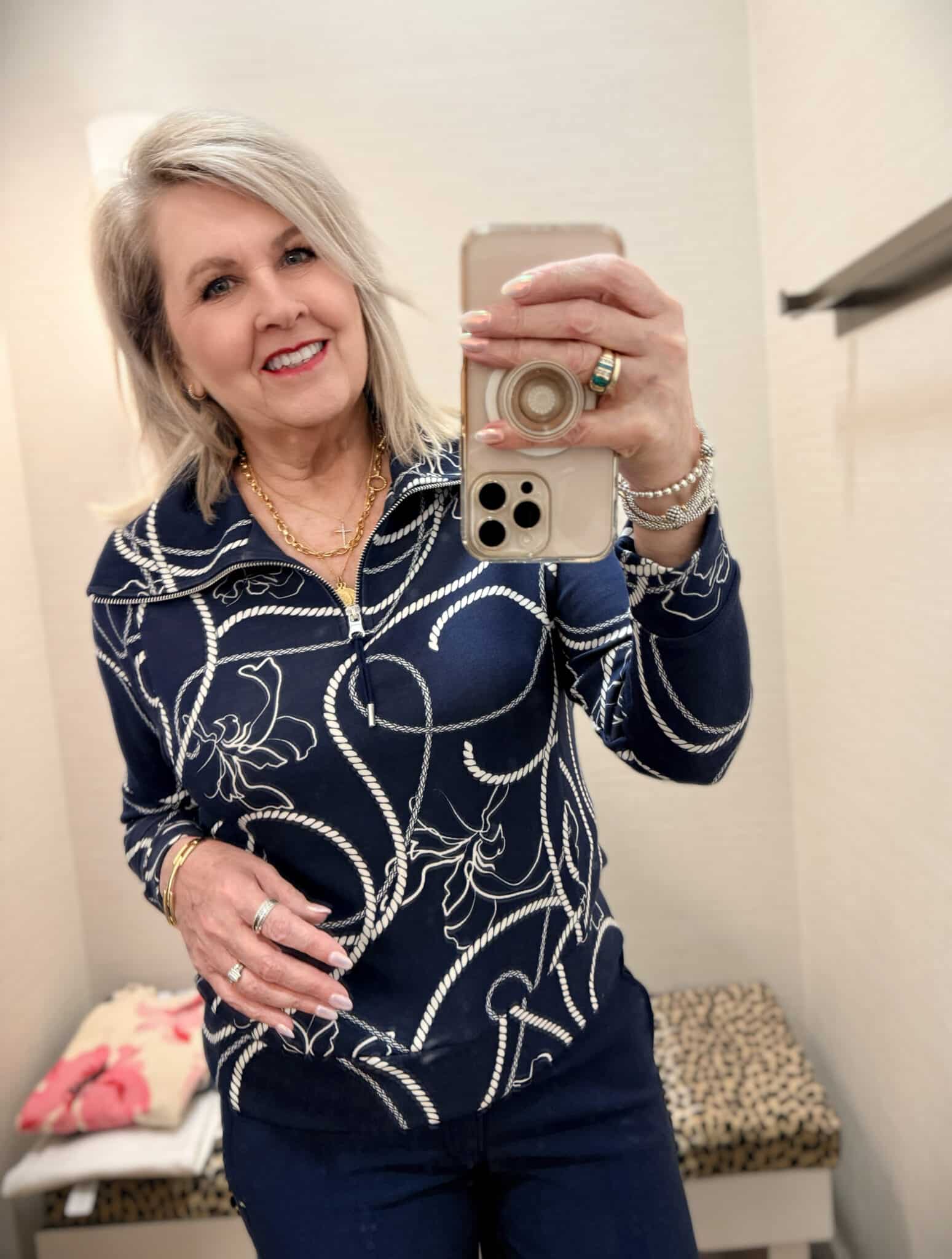 Tania wearing a navy top with white swirls from Chico's New Arrivals