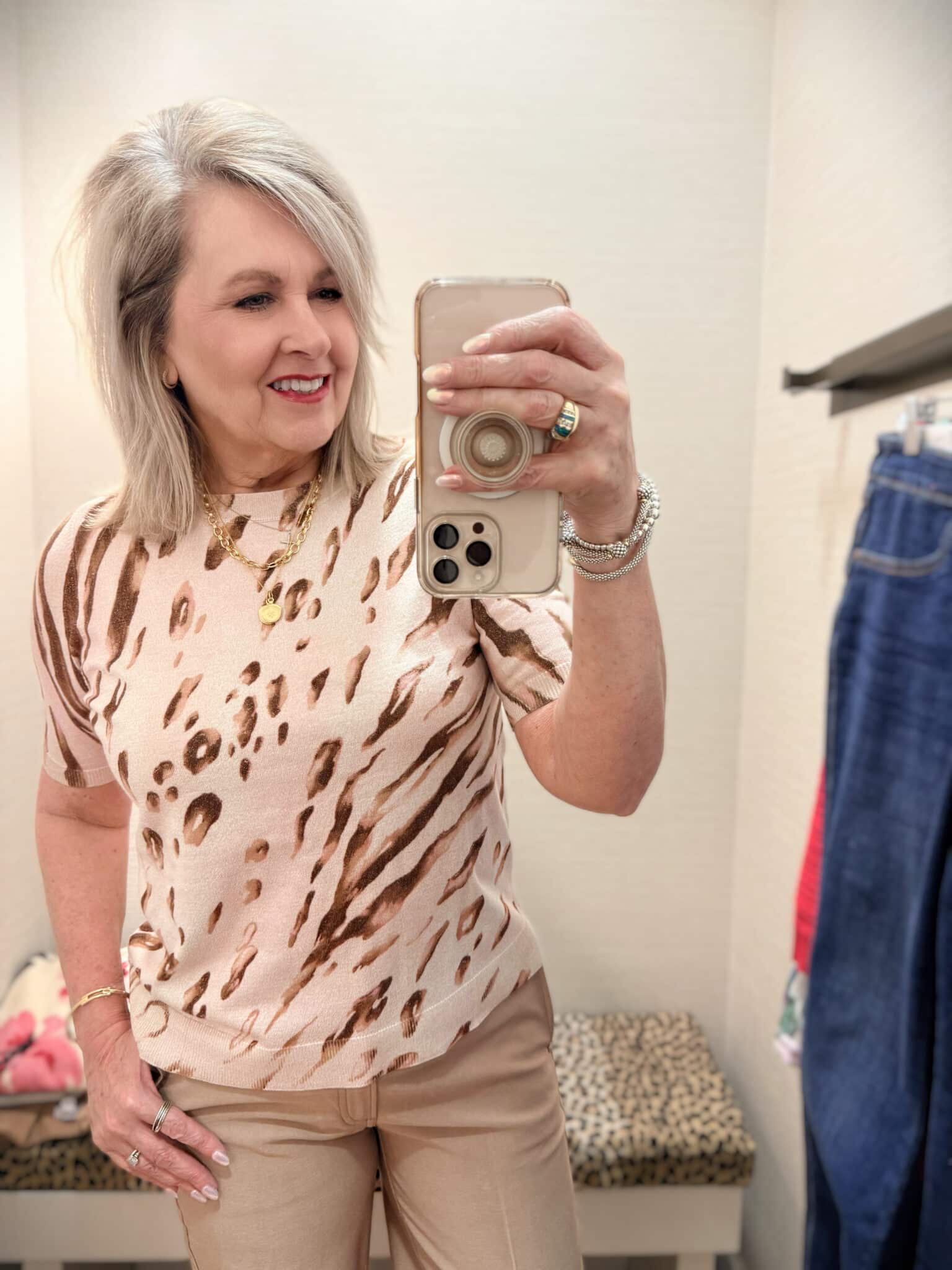 Tania wearing a beige metallic sweater with animal print from Chico's new arrivals