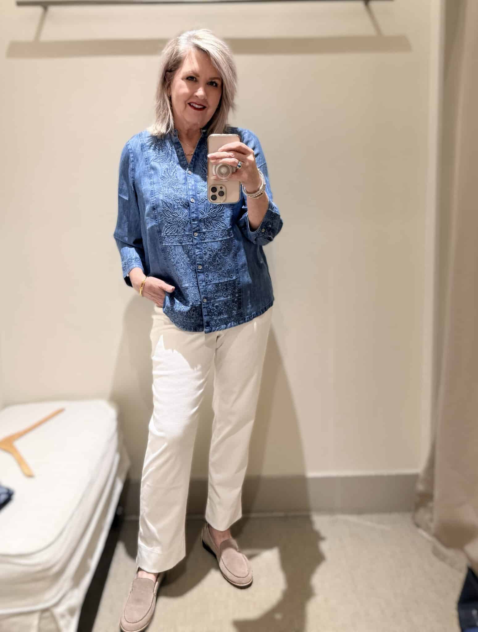 Tania wearing an embroidered chambray shirt and white pull on pants from J.Jill