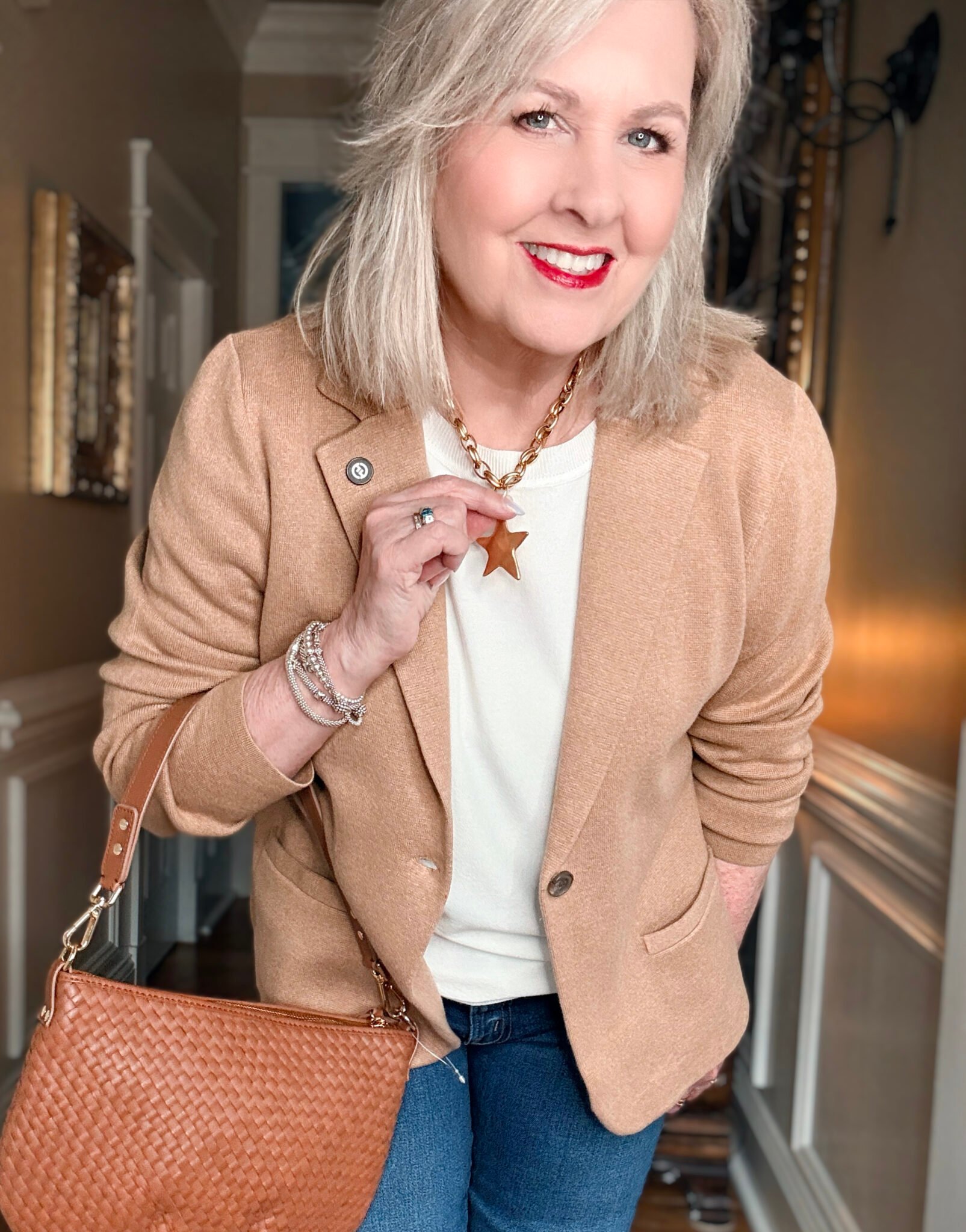 Tearing wearing a Star Necklace from Bracha