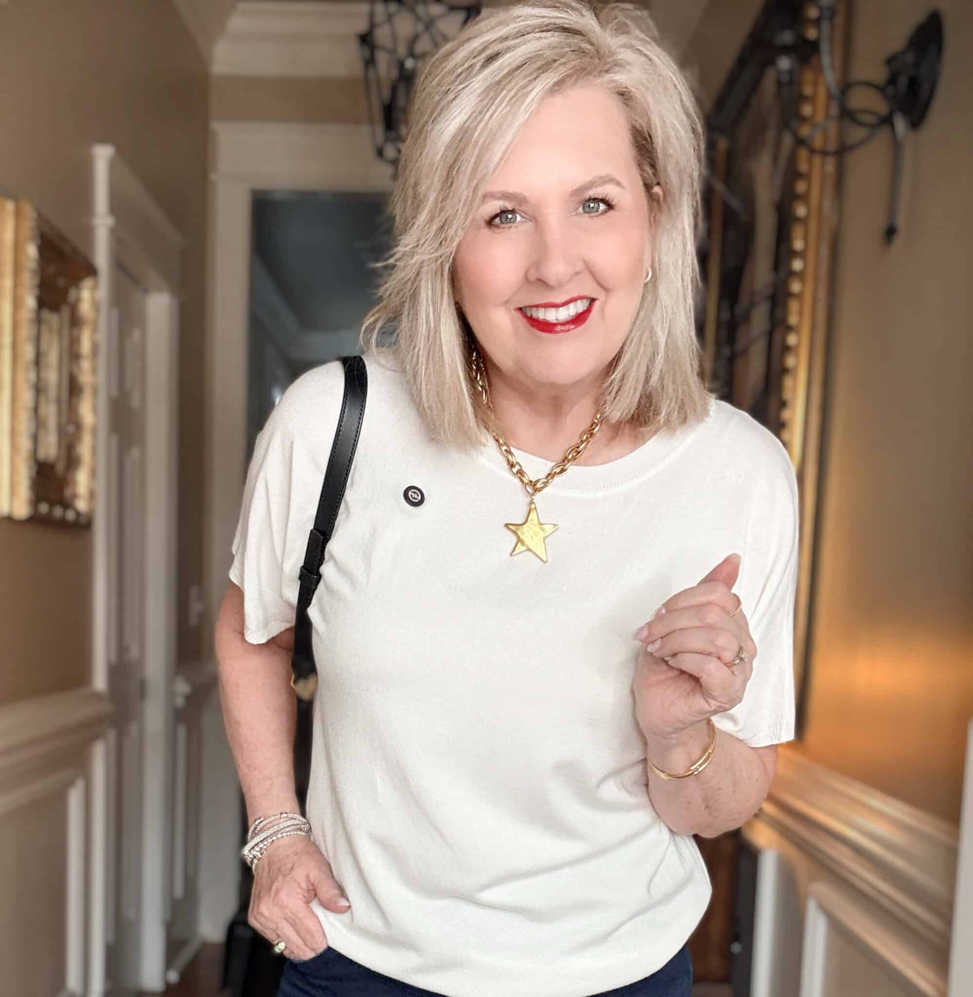 Tania wearing a white short sleeve sweater