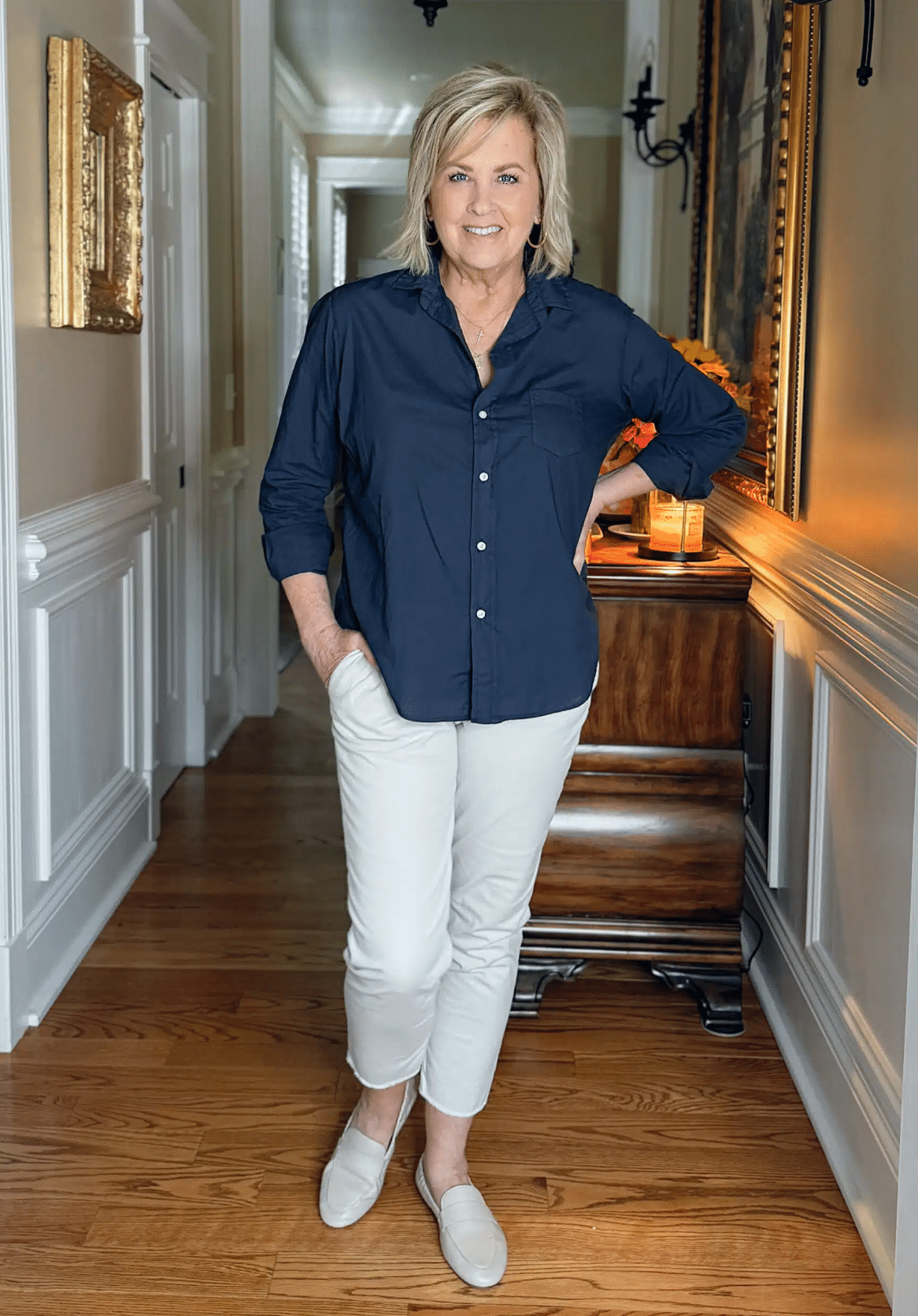 Tania wearing a navy top and cement chinos