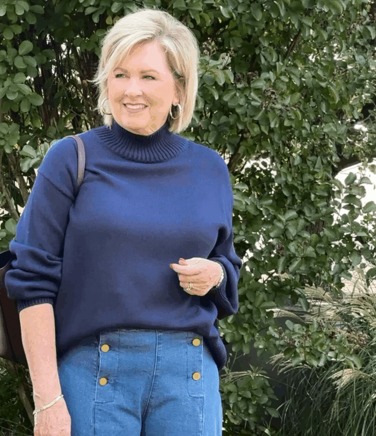 Tania wearing a navy mock neck sweater from Amazon