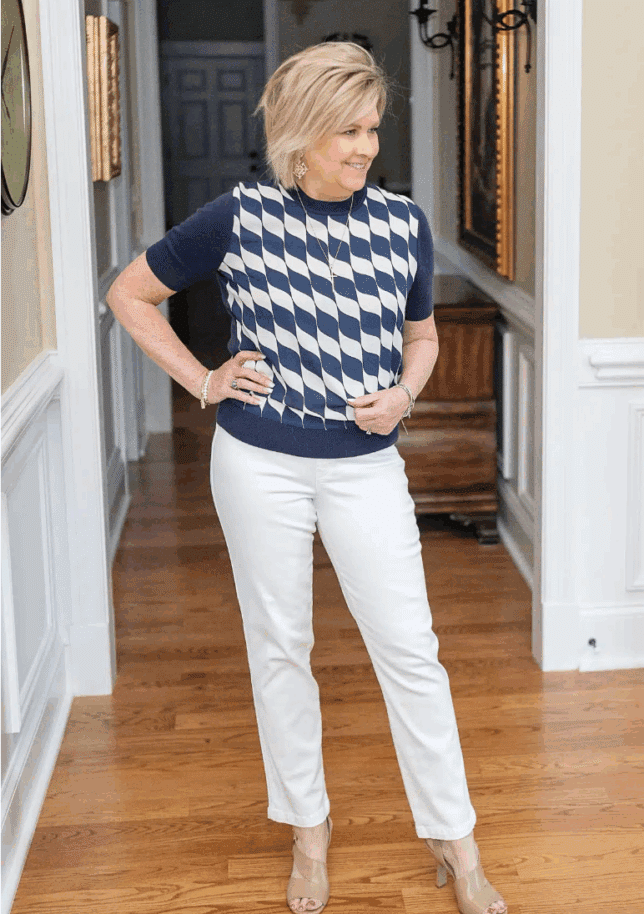 Fashion Blogger, 50 Is Not Old is wearing white slim straight denim ankle jeans from SPANX7