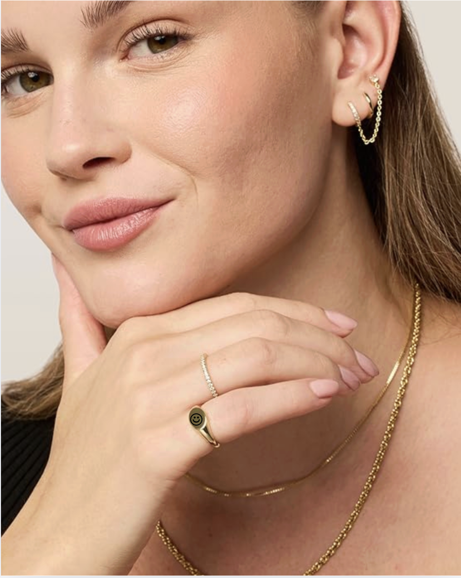 woman wearing a Pinky Signet Ring