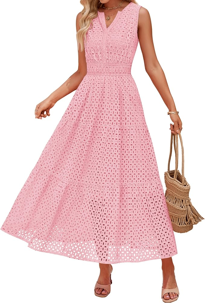 Woman wearing sleeveless pink eyelet maxi dress for spring holiday