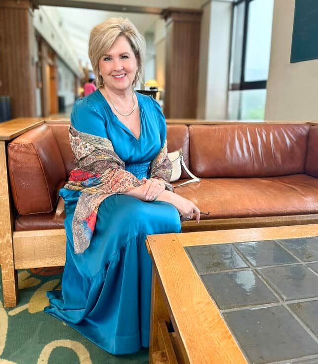 Tania wearing a washable silk tiered dress from Quince