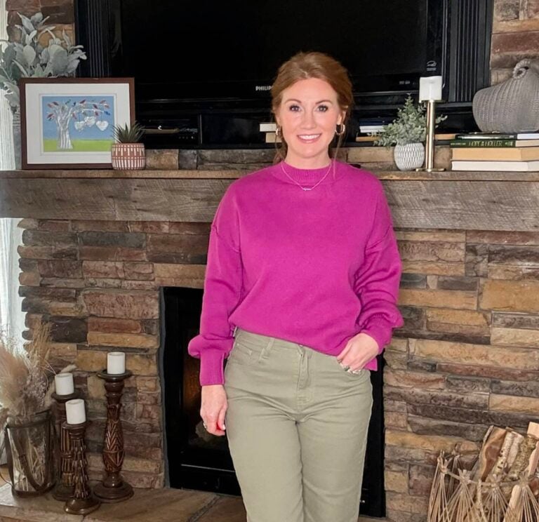 Stephanie wearing cropped green jeans with a bright fuchsia top from Amazon
