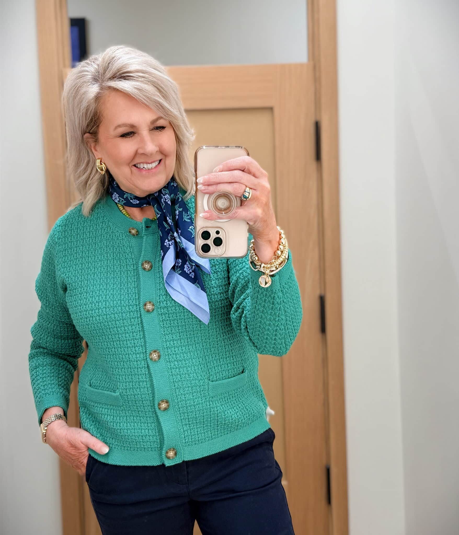 Tania wearing a green cardigan with a scarf from J.Crew Factory