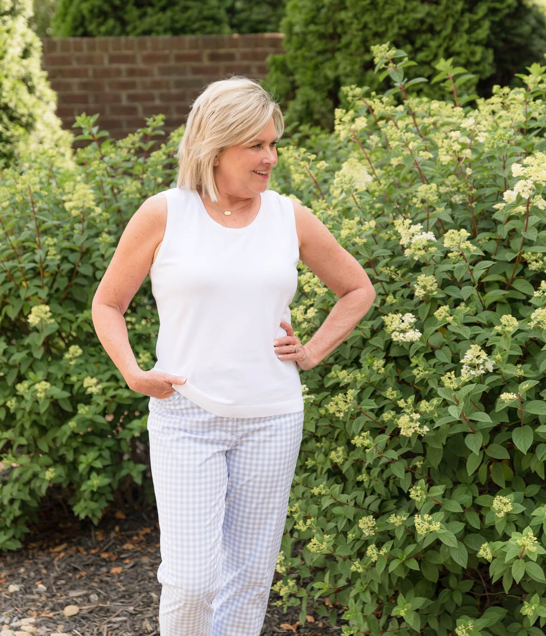 TANIA WEARING GINGHAM PANTS WITH A WHITE TANK