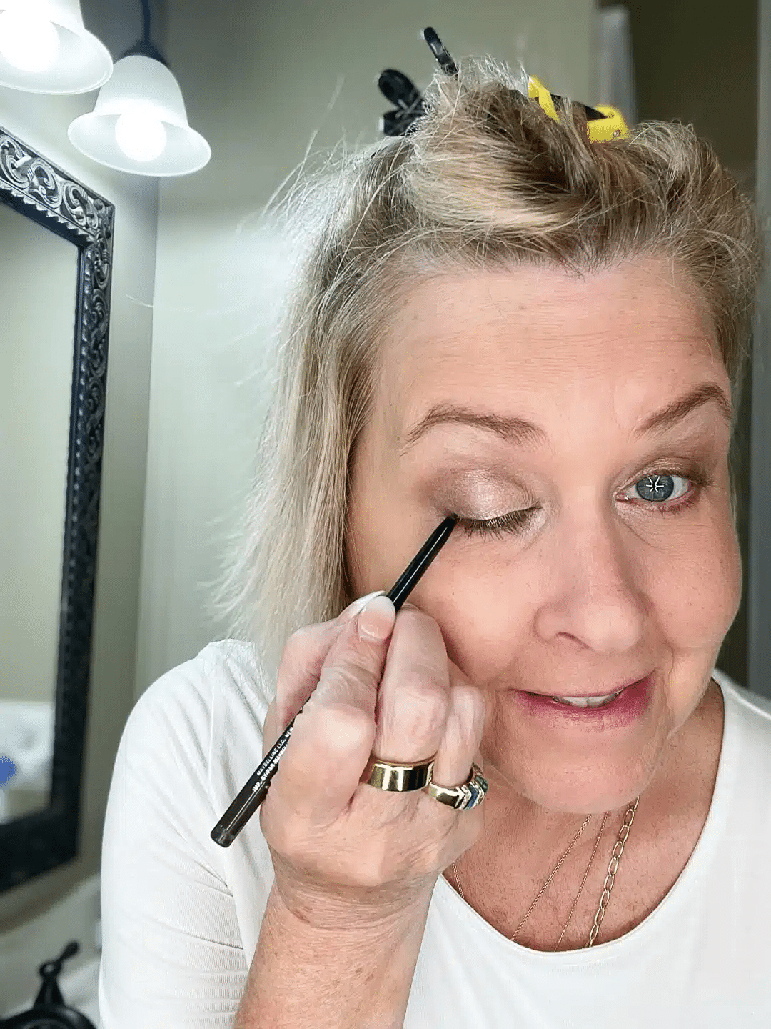 Tania applying eyeliner