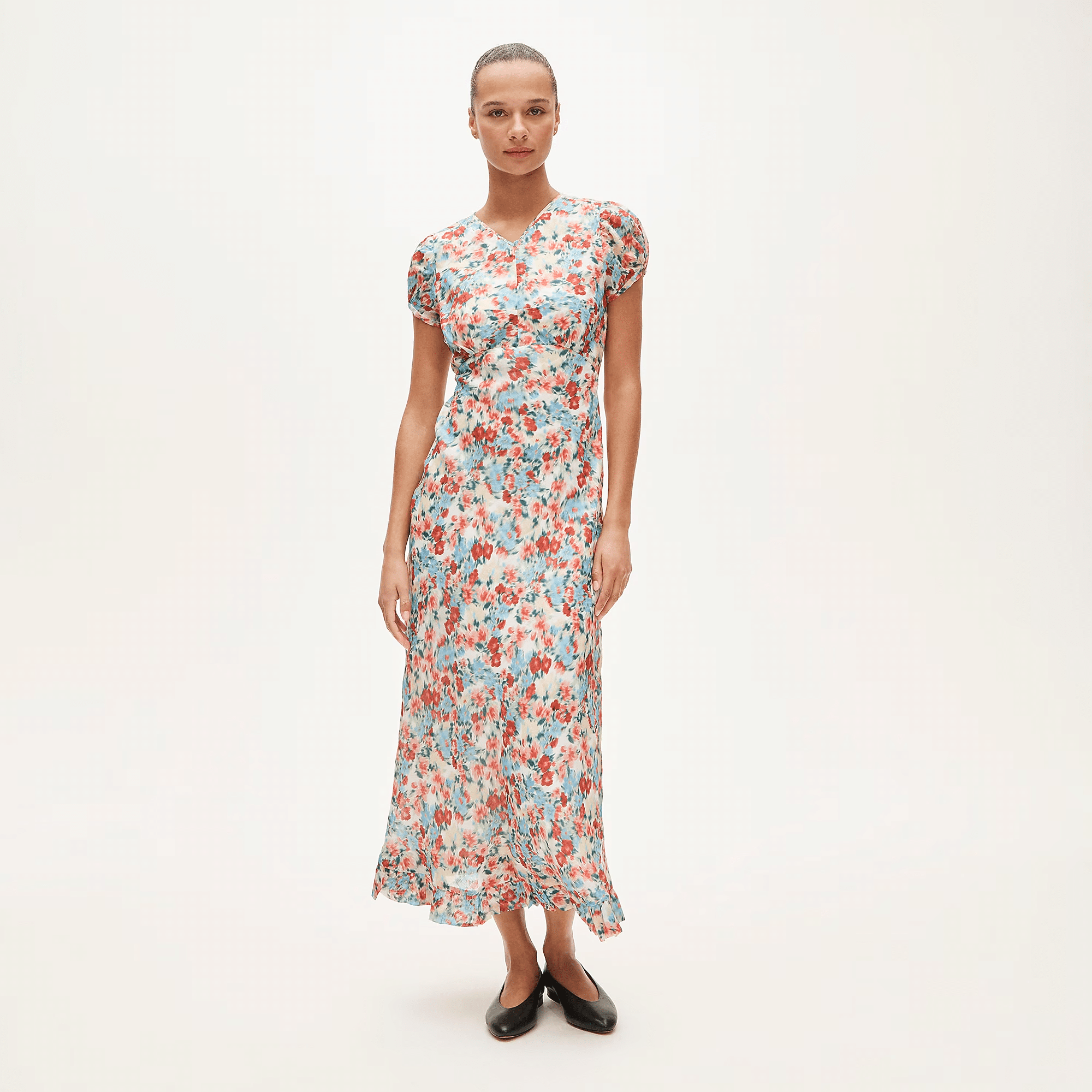Woman wearing ruffle hem midi dress for spring ceremony