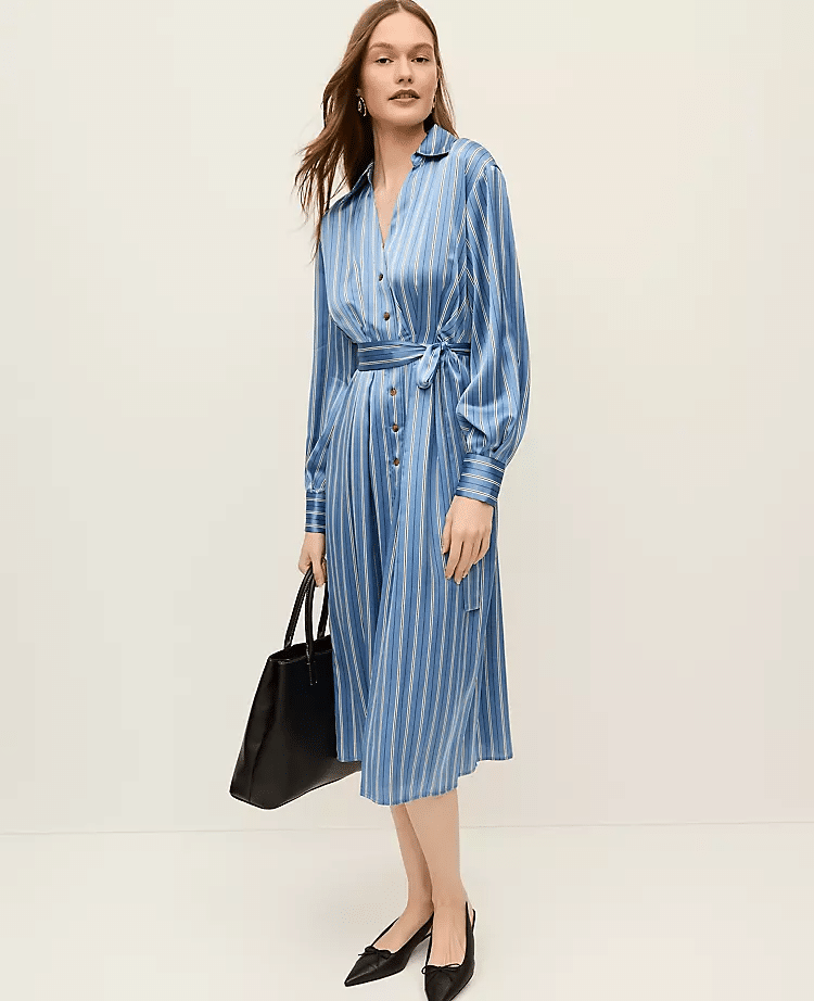 Woman wearing striped satin midi shirtdress