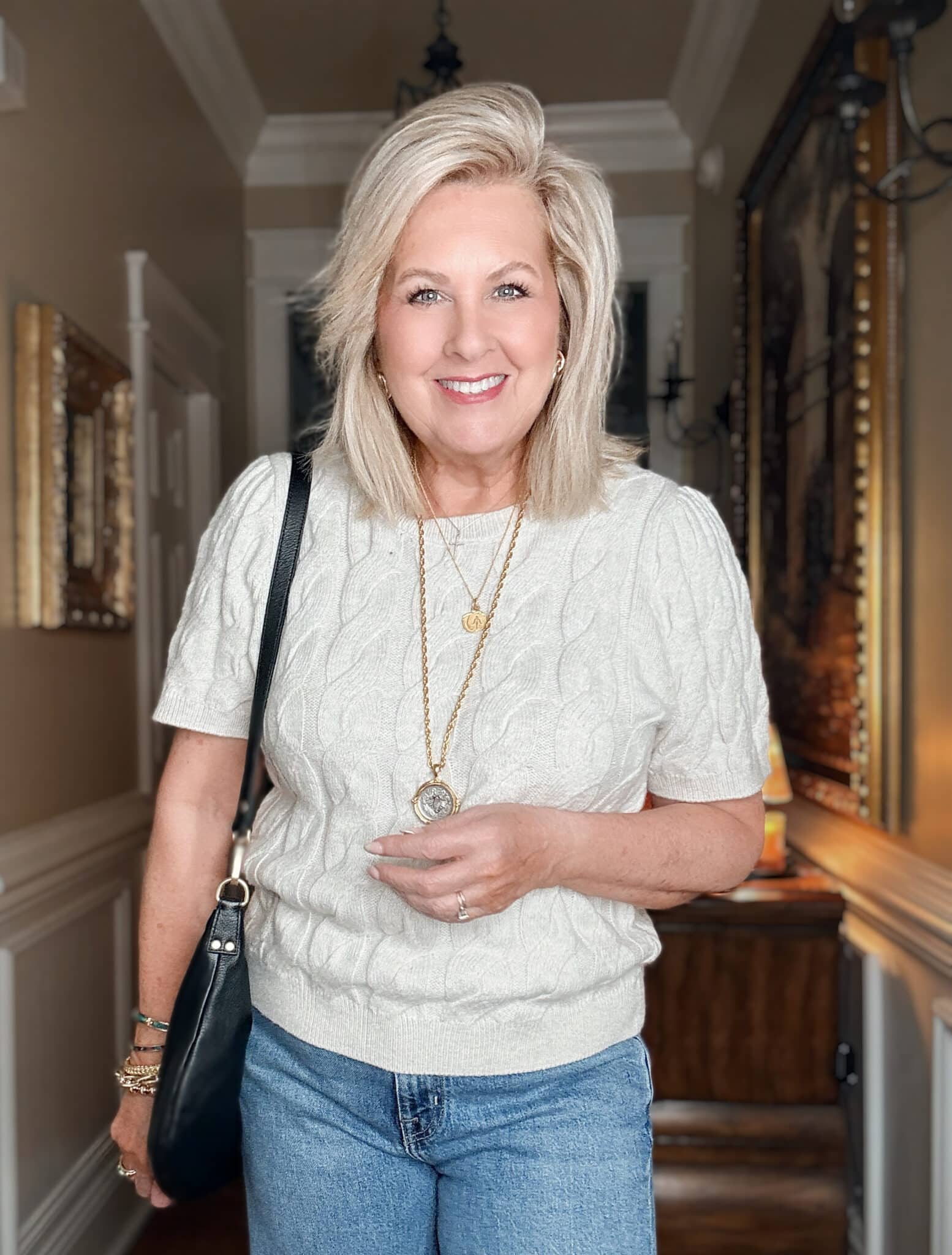 Tania wearing a cable knit cream sweater from Nordstrom
