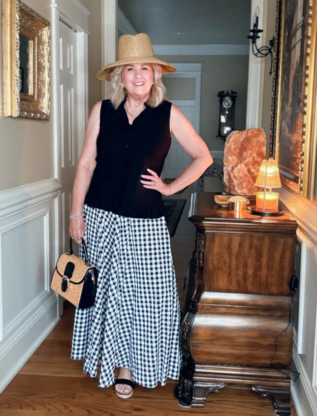 Tania, from 50 Is Not Old, wearing a gingham skirt with black for spring 2026