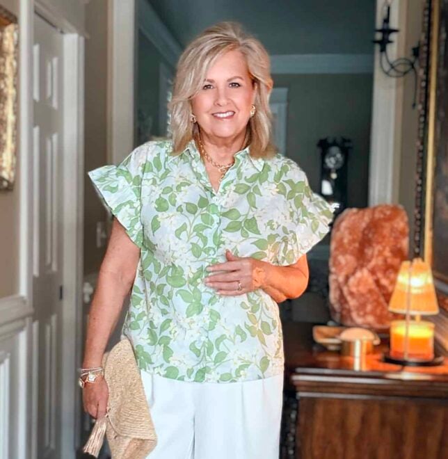 Tania showing how a floral ruffle sleeve top can make you look younger