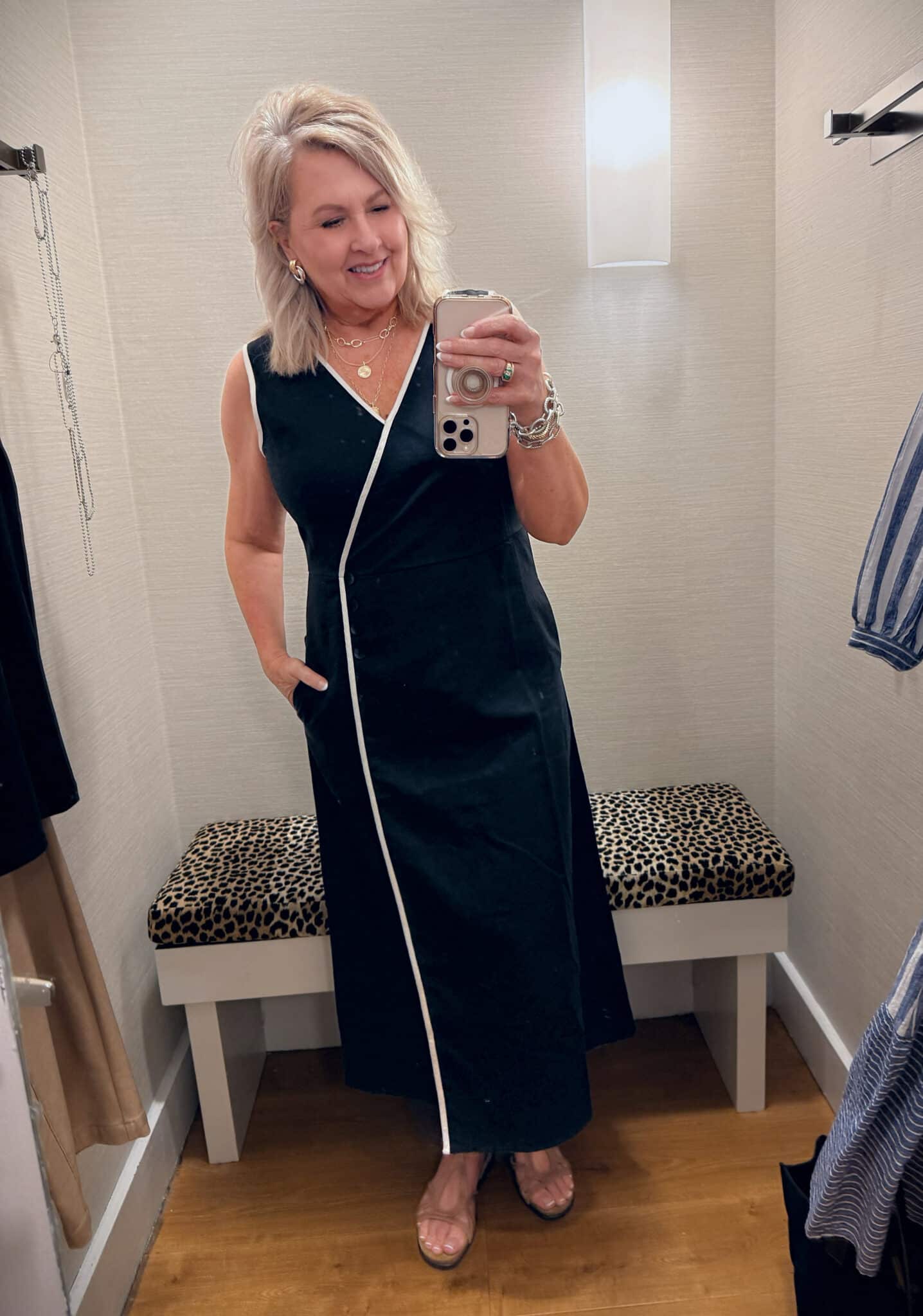Tania wearing a Chico's black dress with white piping detail