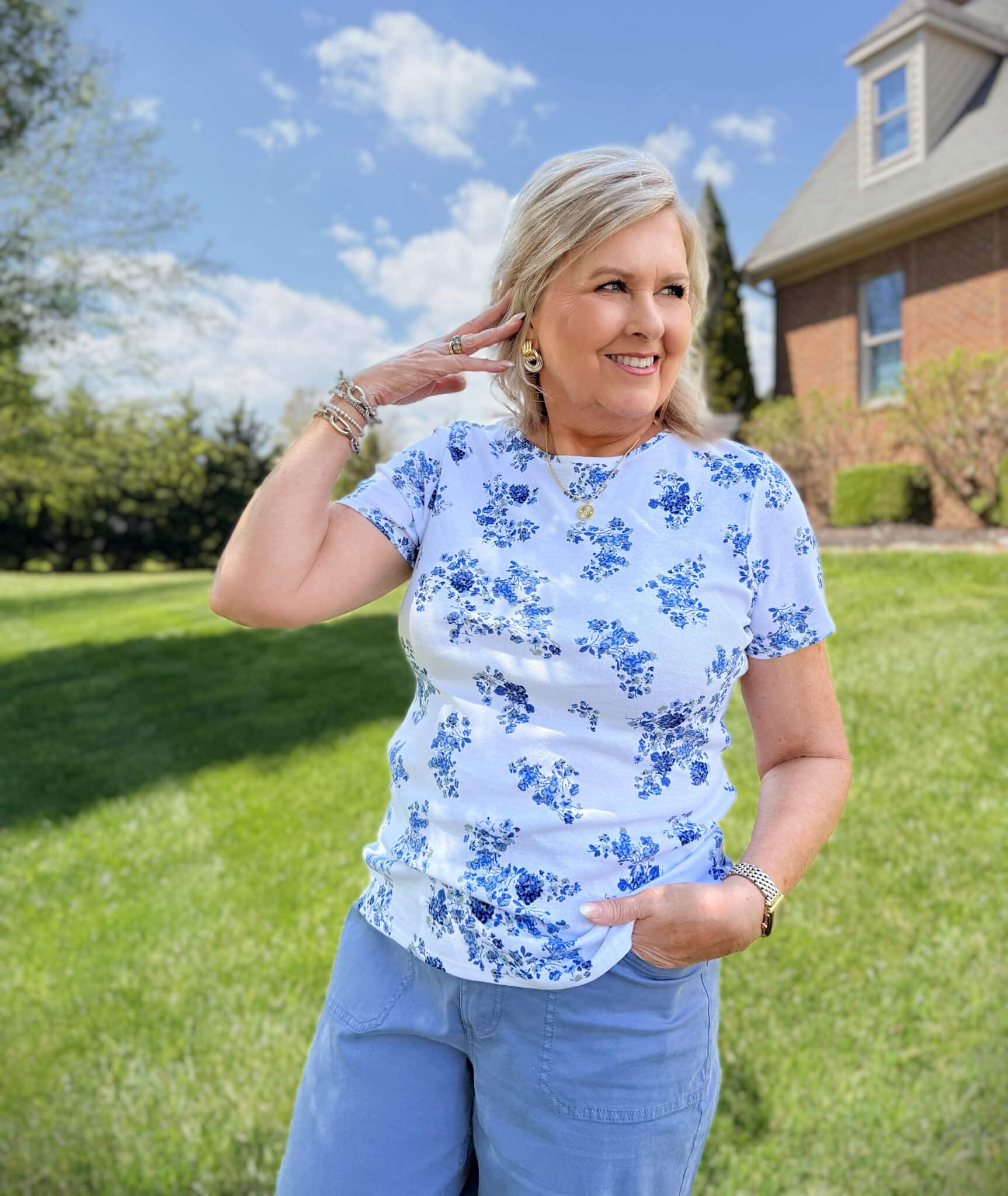 Tania from 50 is not old, is wearing a blue floral tee from Kohls