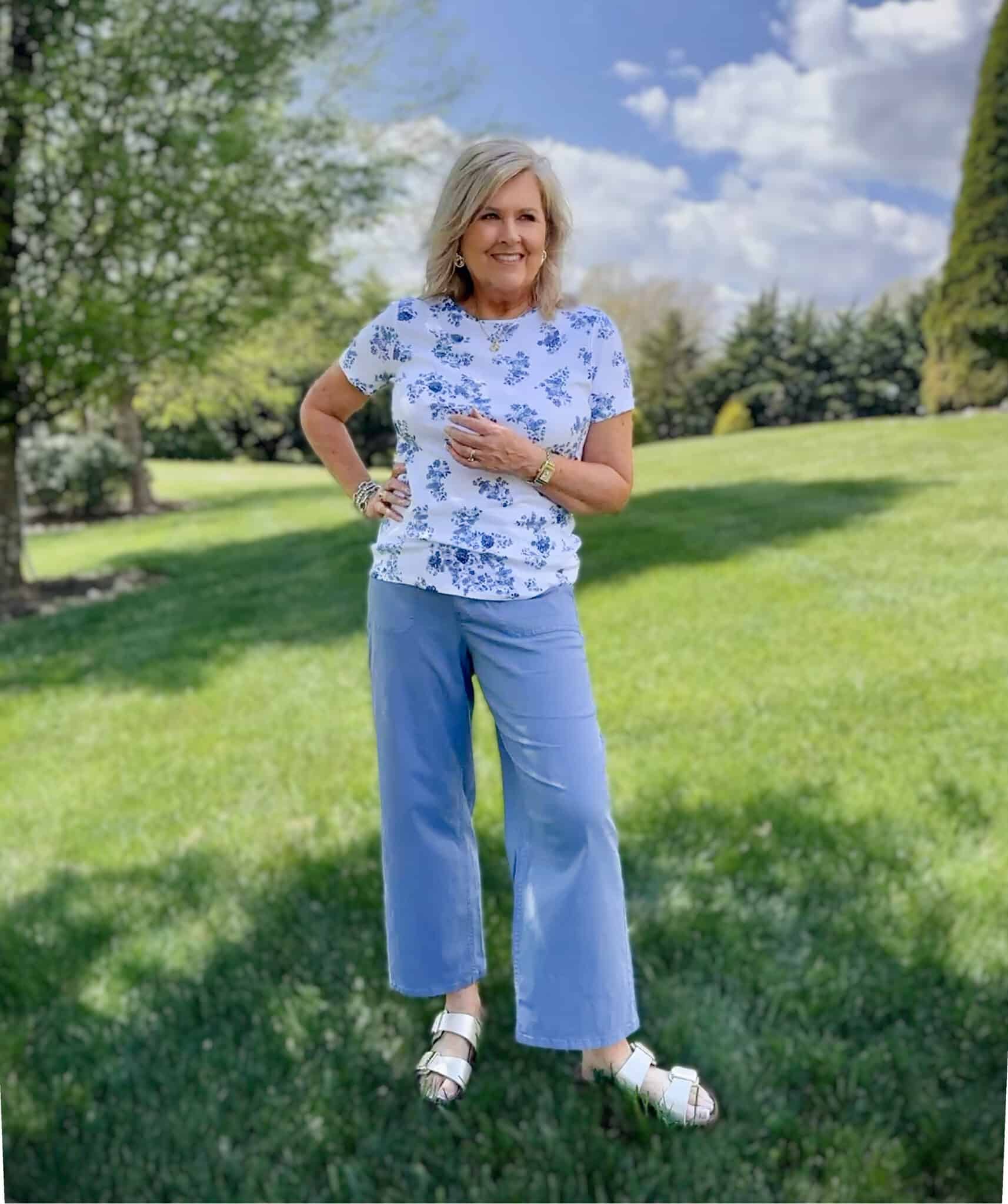 Tania from 50 is not old, is wearing a blue floral tee with cornflower blue pants from Kohls