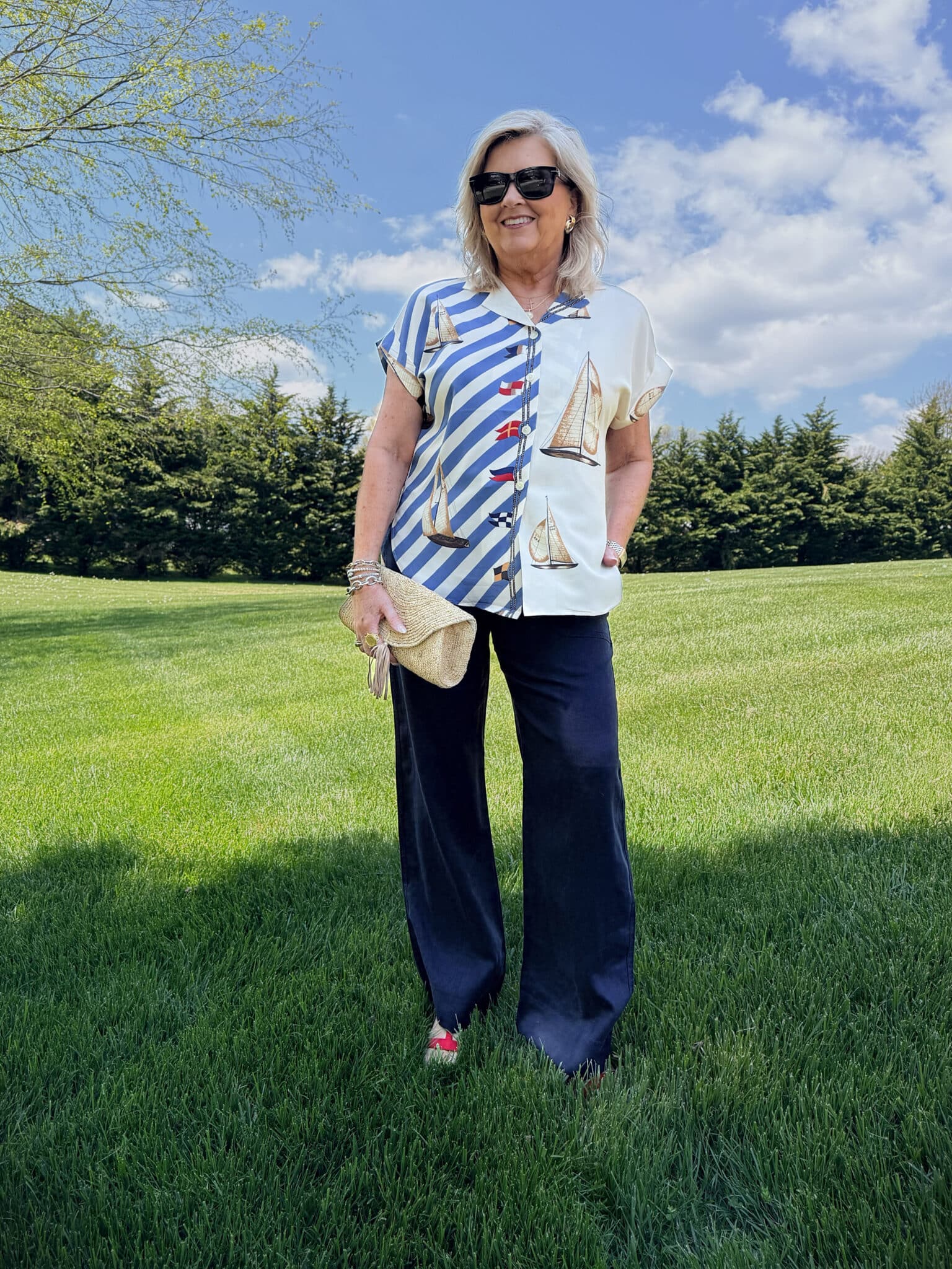 Tania wearing a nautical button up shirt and navy linen pants from Macy's