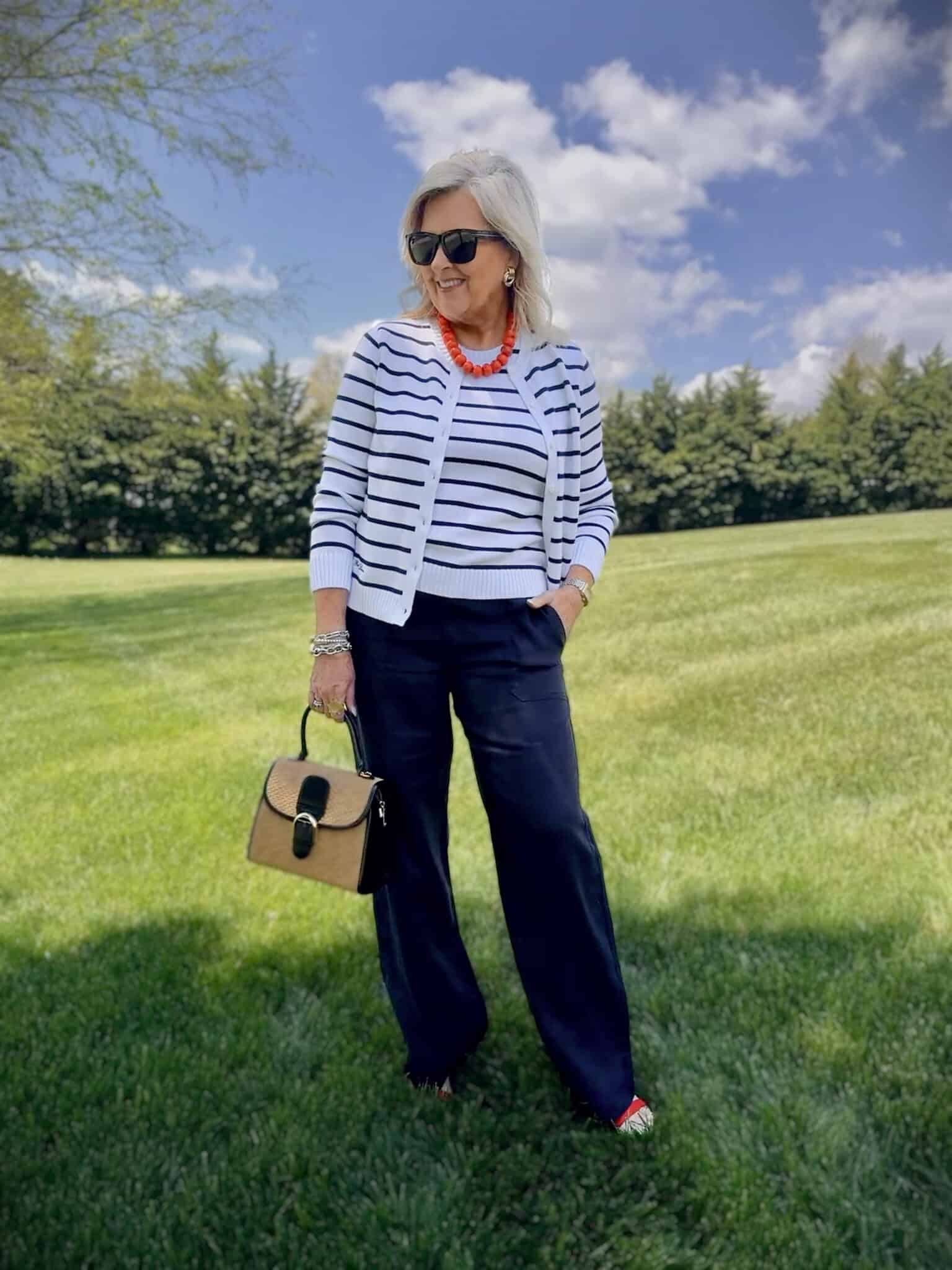 Tania wearing a striped navy & white sweater and shell with navy linen pants from Macy's