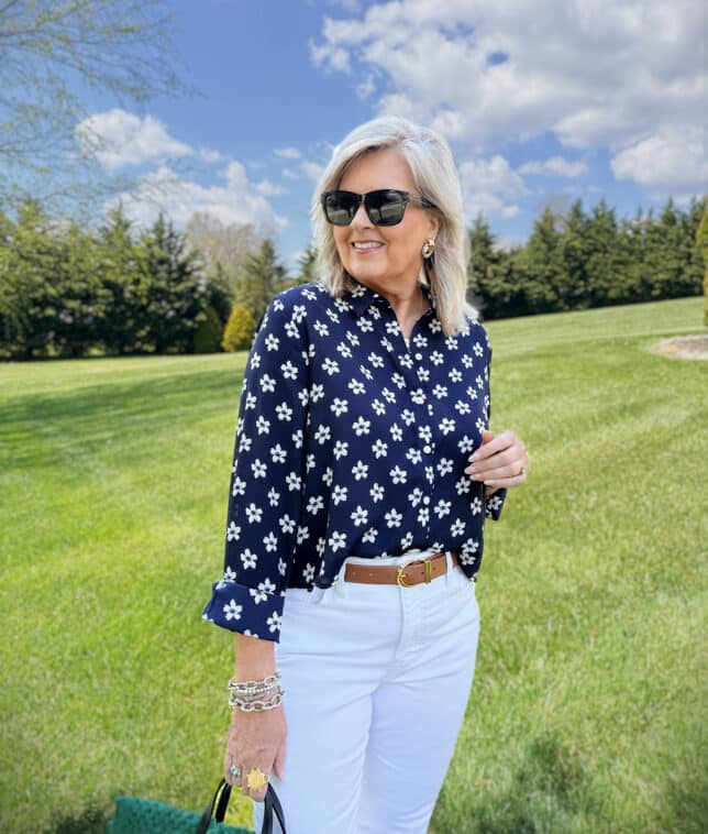Tania wearing a navy & white floral button up shirt from Macy's