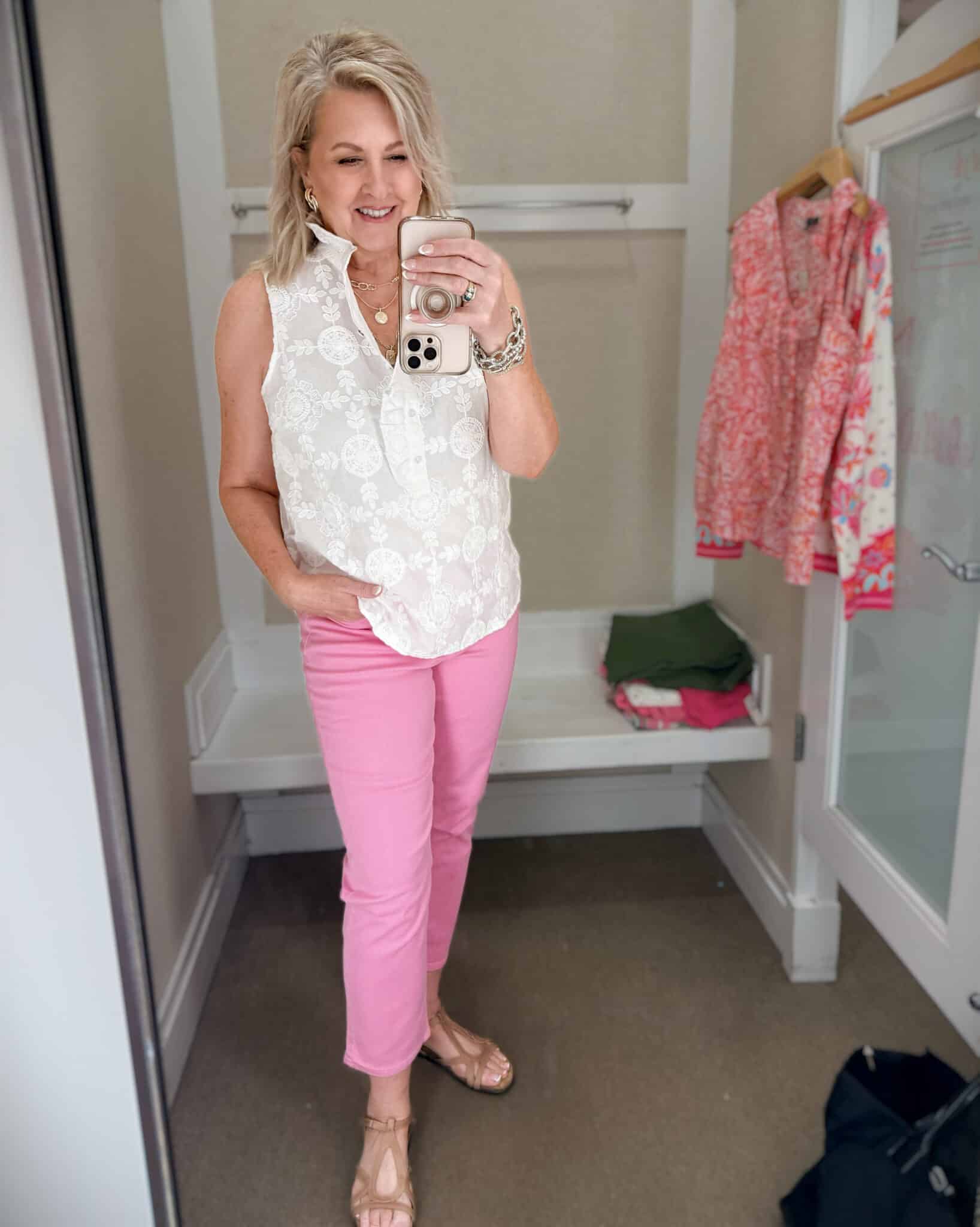 Tania wearing a white ruffle lace shirt with embroidered sailboat with pink lightweight jeans from Talbots